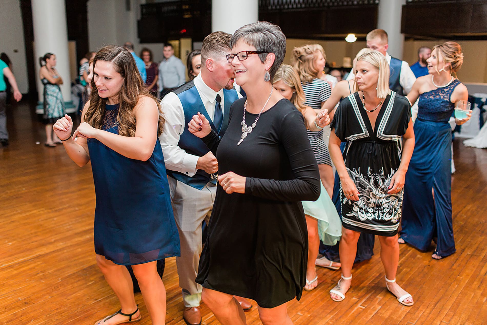 Arielle Peters Photography | Wedding guests dancing at reception on wedding day at the Freemasons Hall in Fort Wayne, Indiana.