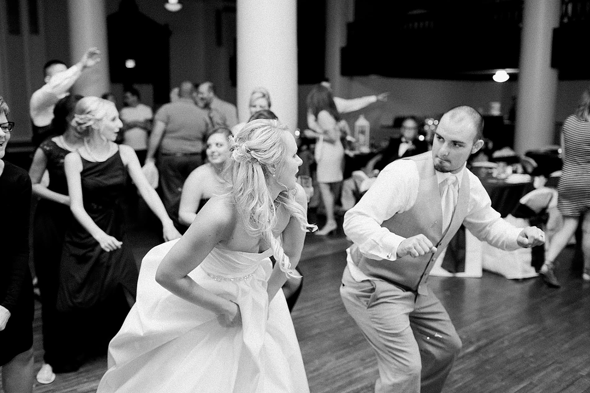 Arielle Peters Photography | Wedding guests dancing at reception on wedding day at the Freemasons Hall in Fort Wayne, Indiana.