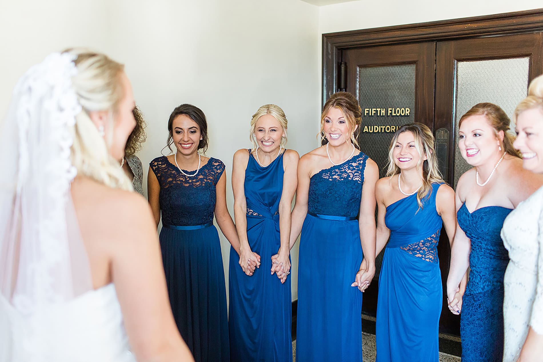Arielle Peters Photography | Bride and bridesmaids having first reveal on wedding day at the Freemasons Hall in Fort Wayne, Indiana.