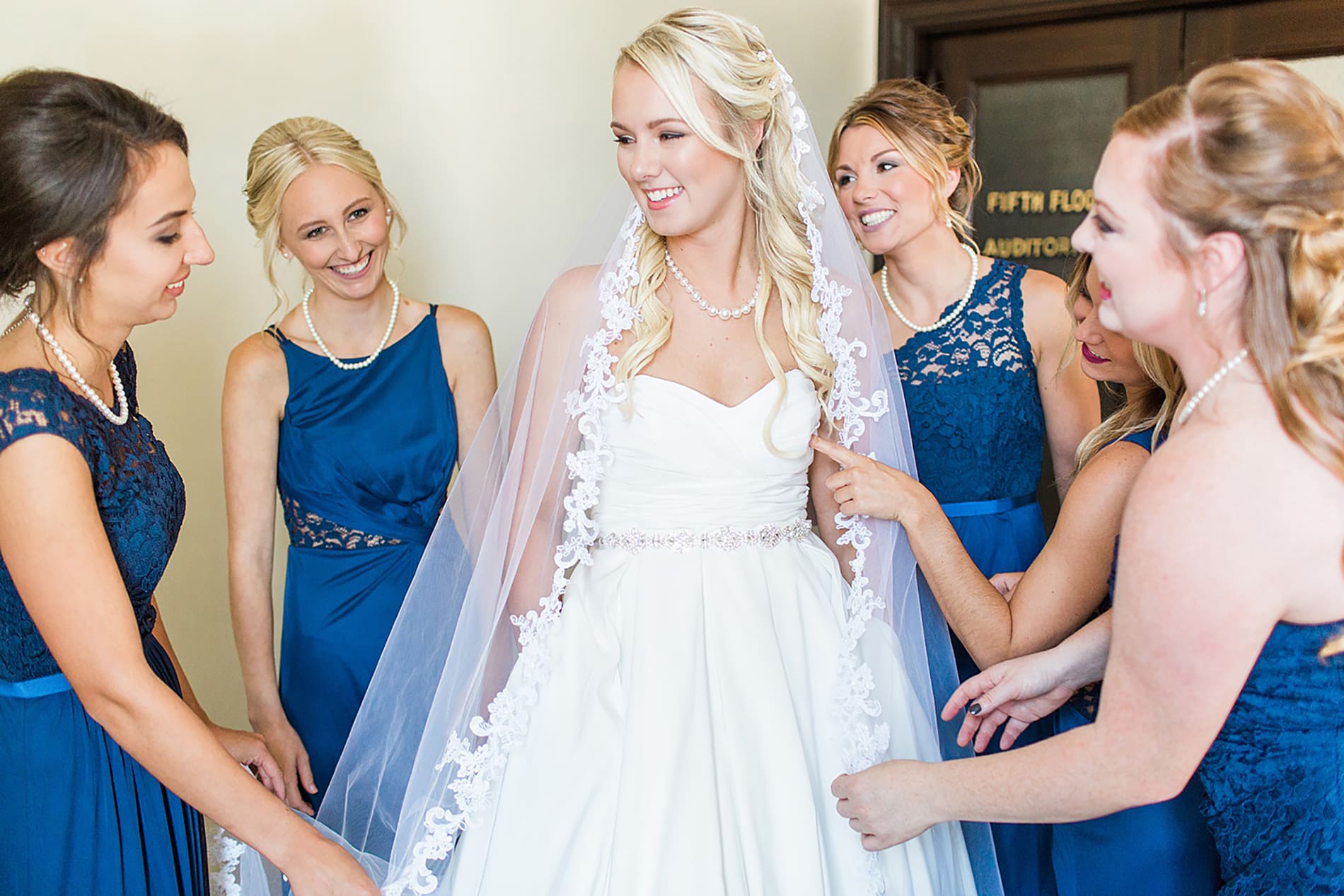 Arielle Peters Photography | Bride and bridesmaids having first reveal on wedding day at the Freemasons Hall in Fort Wayne, Indiana.