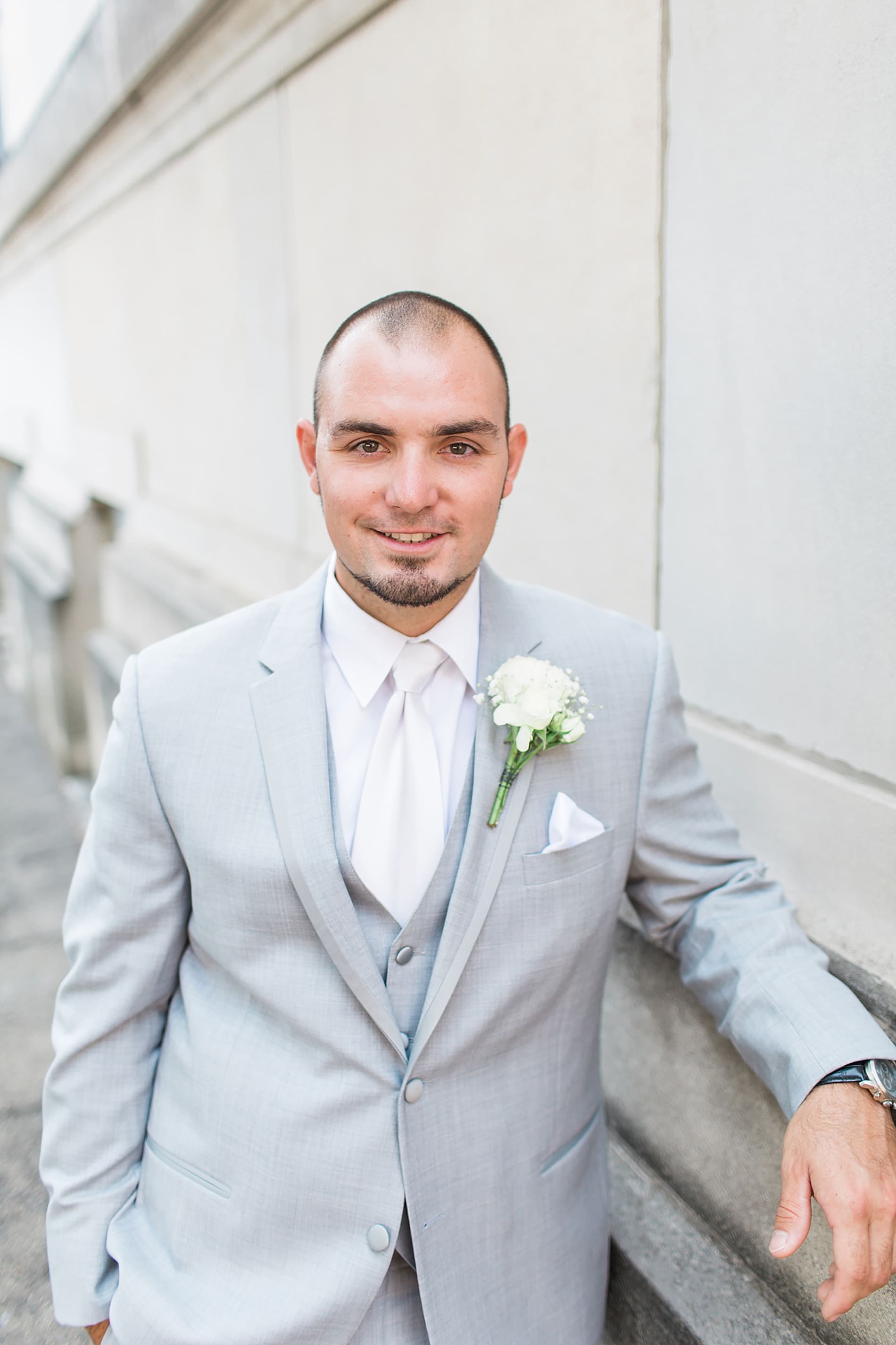 Arielle Peters Photography | Groom outside church on wedding day at the Freemasons Hall in Fort Wayne, Indiana.