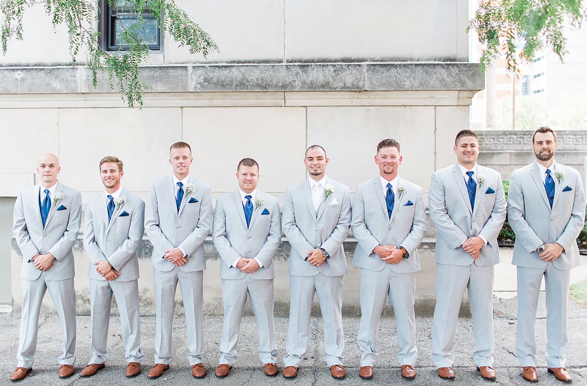Arielle Peters Photography | Groom and groomsmen outside church steps on wedding day at the Freemasons Hall in Fort Wayne, Indiana.