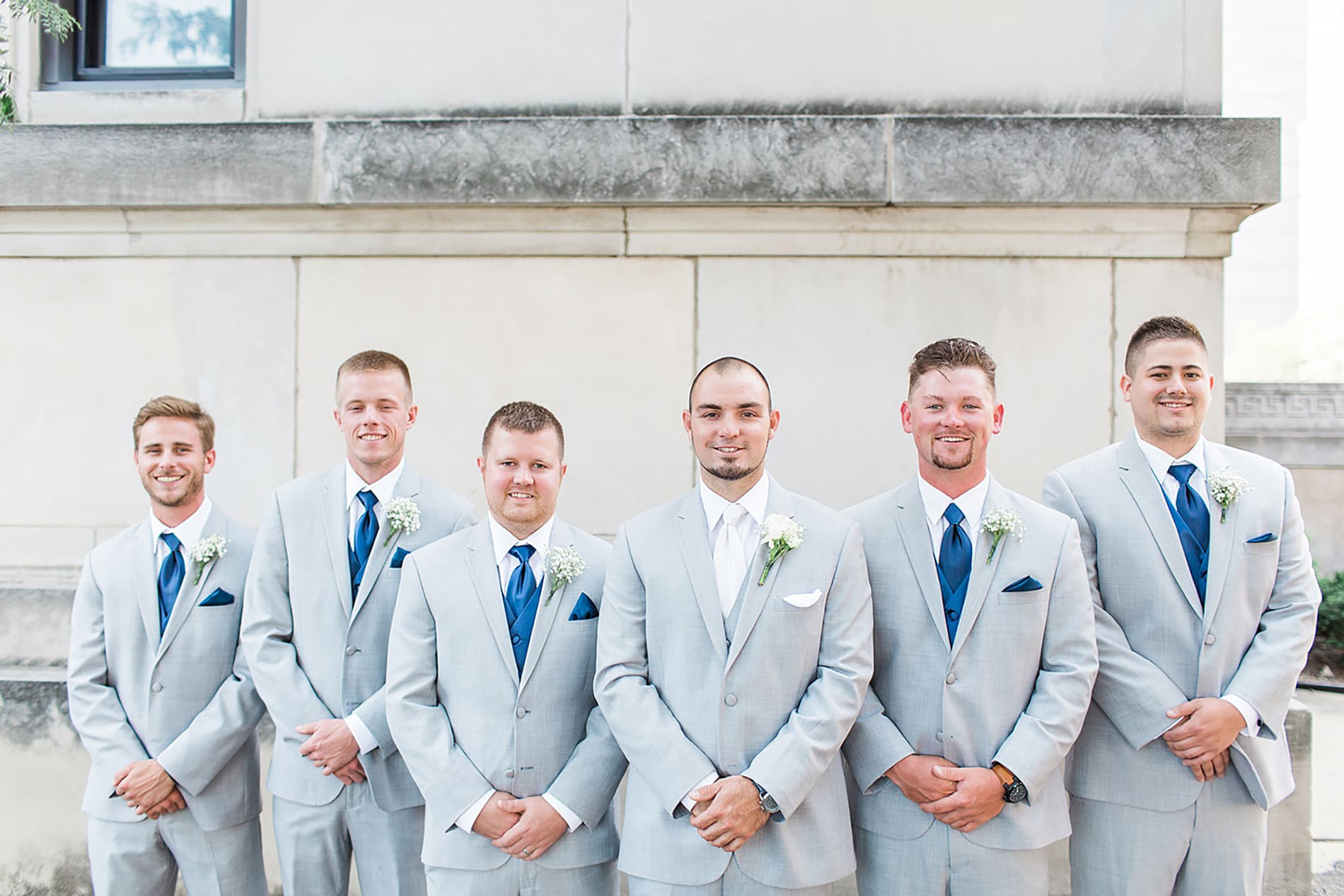 Arielle Peters Photography | Groom and groomsmen next to church on wedding day at the Freemasons Hall in Fort Wayne, Indiana.