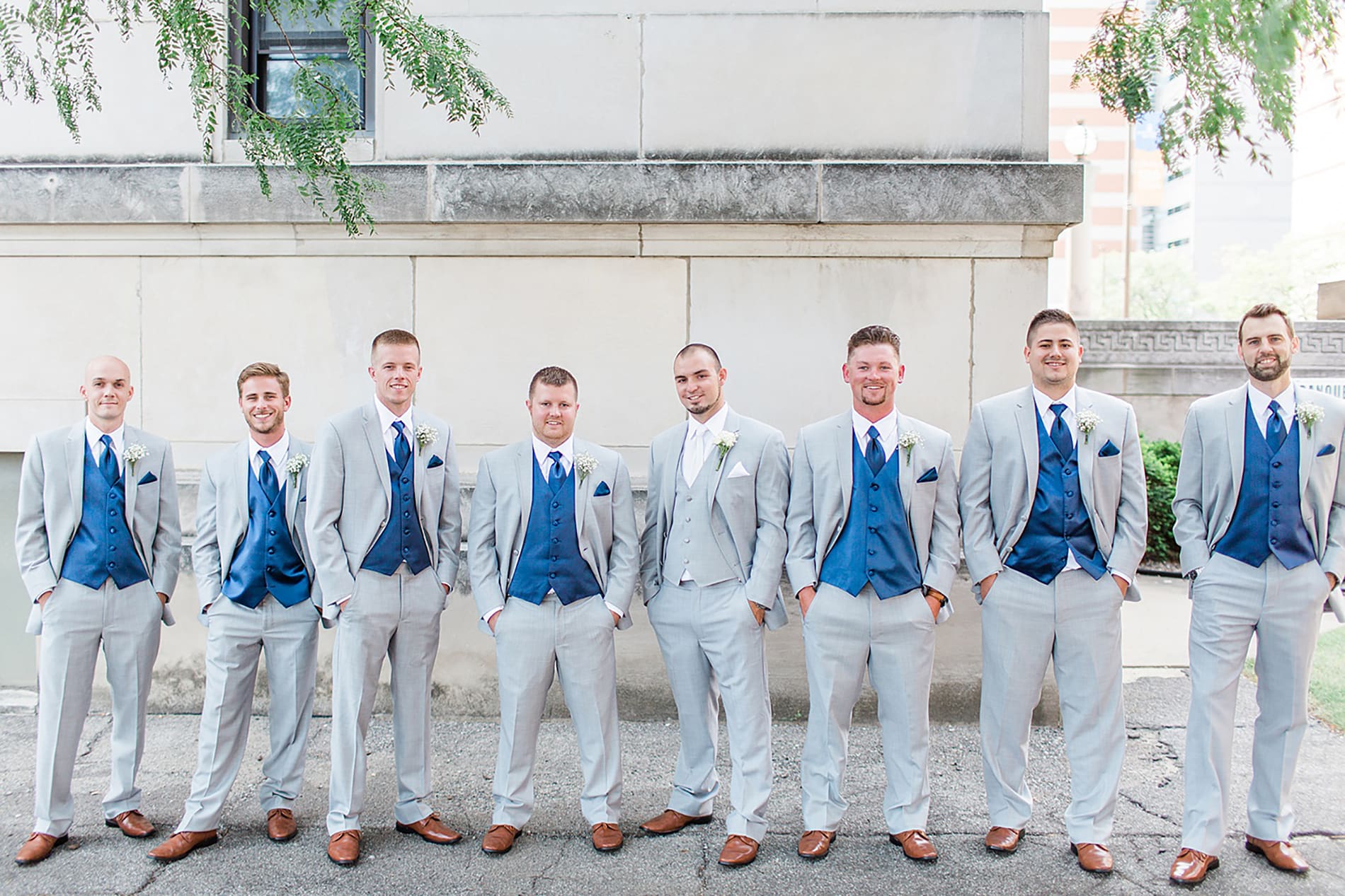 Arielle Peters Photography | Groom and groomsmen next to church on wedding day at the Freemasons Hall in Fort Wayne, Indiana.