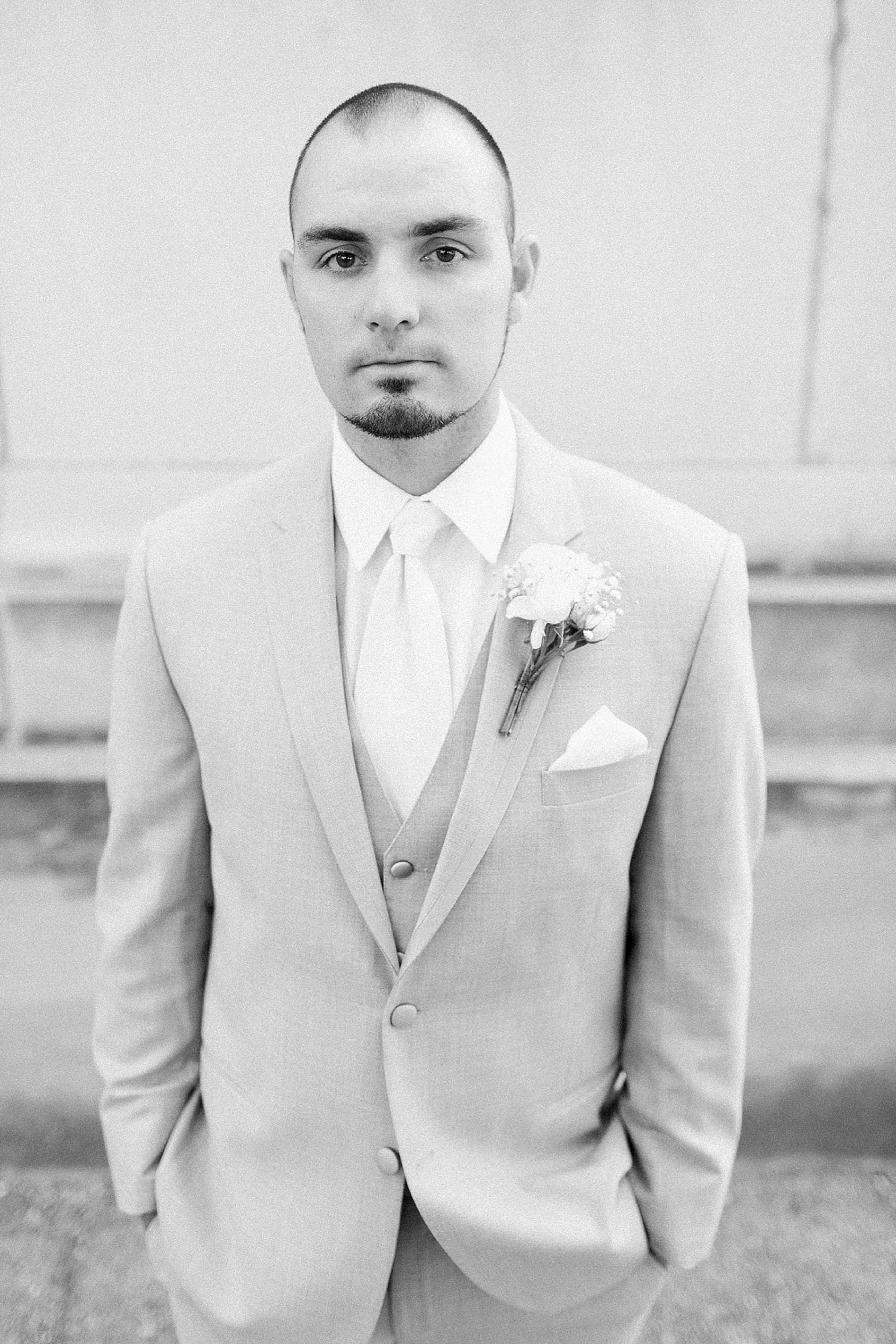 Arielle Peters Photography | Groom standing next to church on wedding day at the Freemasons Hall in Fort Wayne, Indiana.