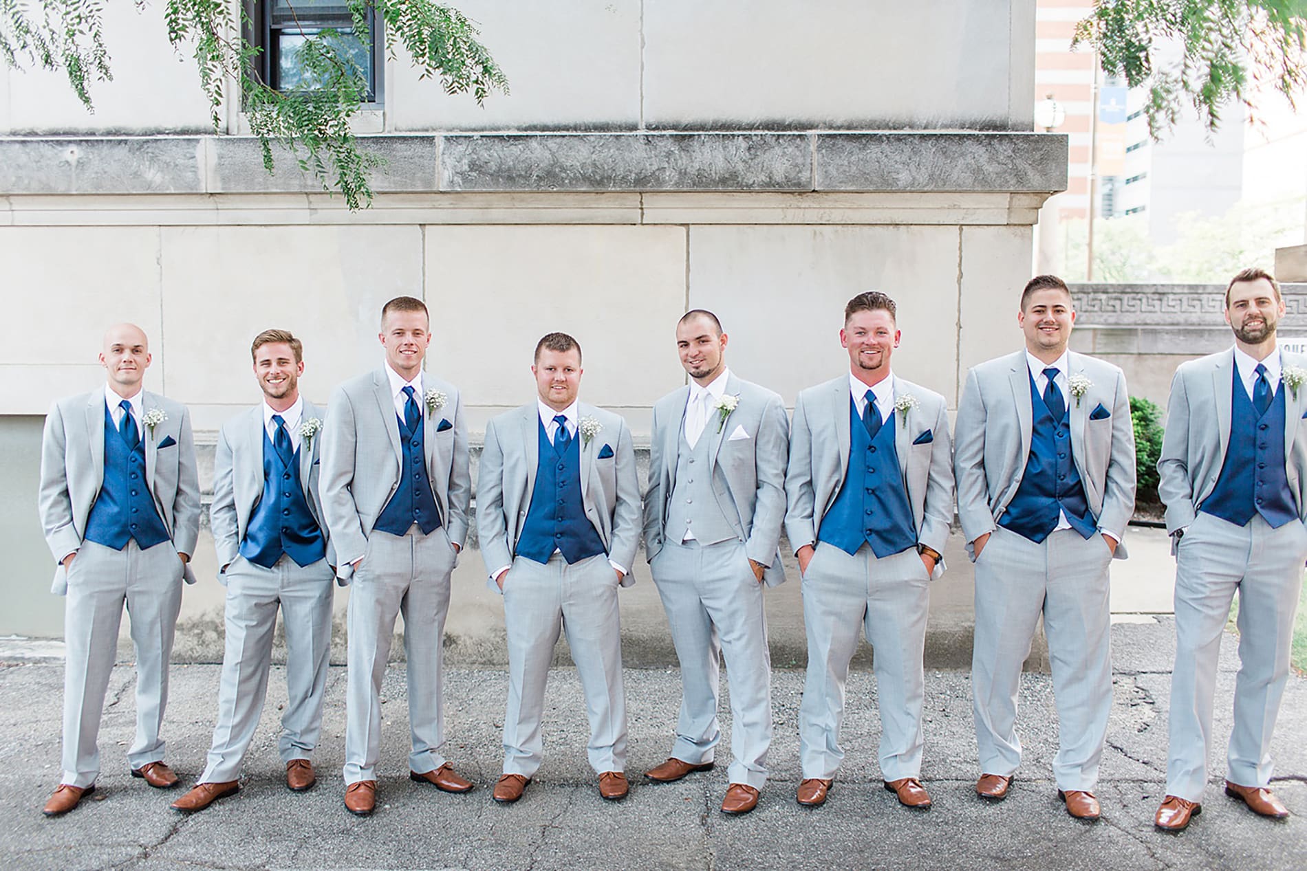 Arielle Peters Photography | Groom and groomsmen standing next to church on wedding day at the Freemasons Hall in Fort Wayne, Indiana.
