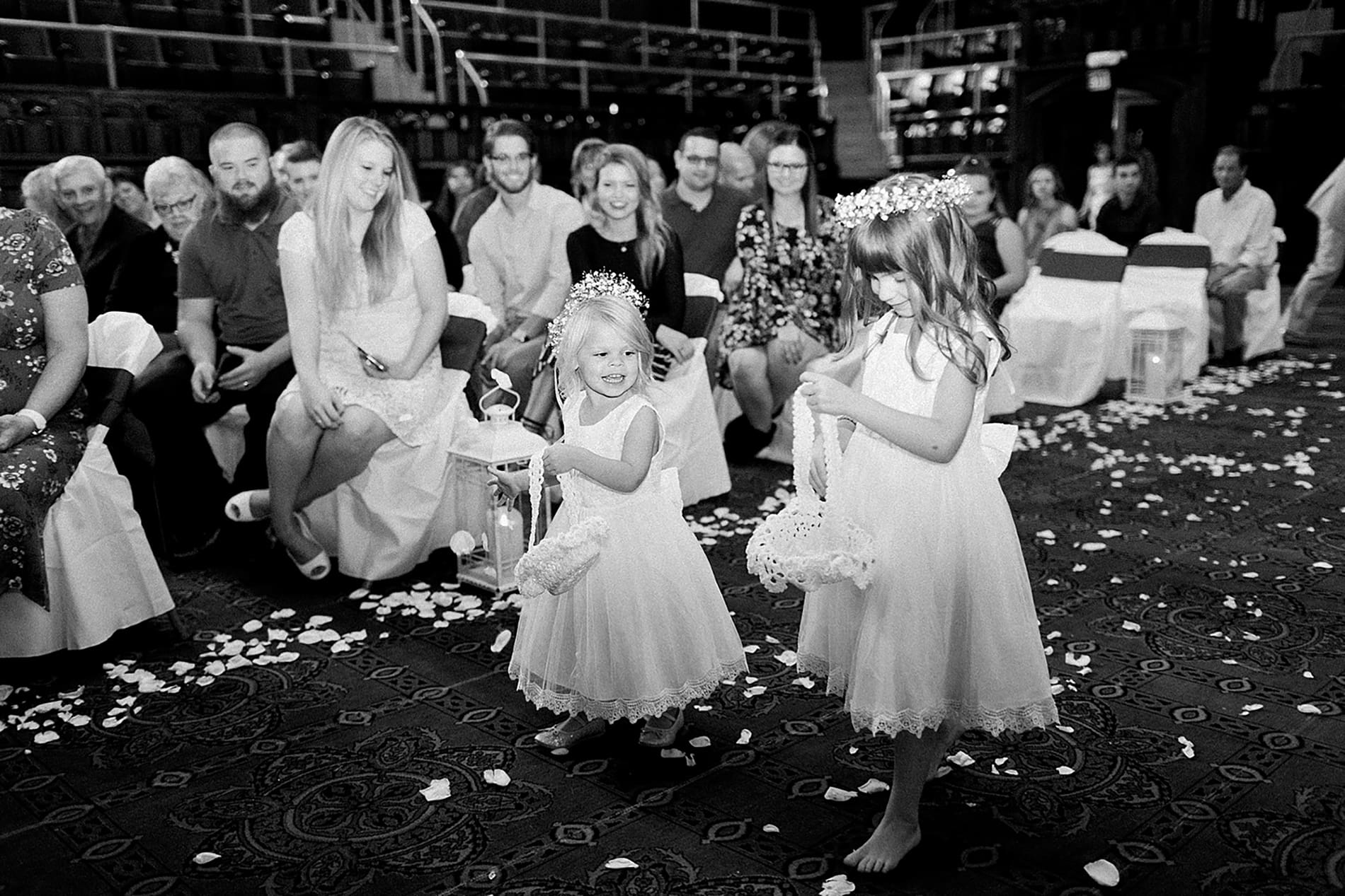 Arielle Peters Photography | Flower girls walking down aisle on wedding day at the Freemasons Hall in Fort Wayne, Indiana.