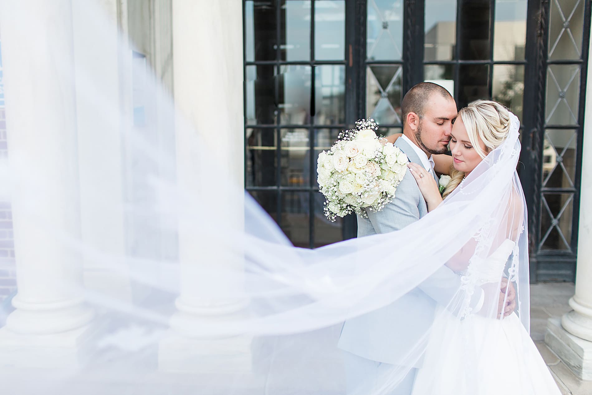 Arielle Peters Photography | Bride and groom slow dancing in city streets on wedding day at the Freemasons Hall in Fort Wayne, Indiana.