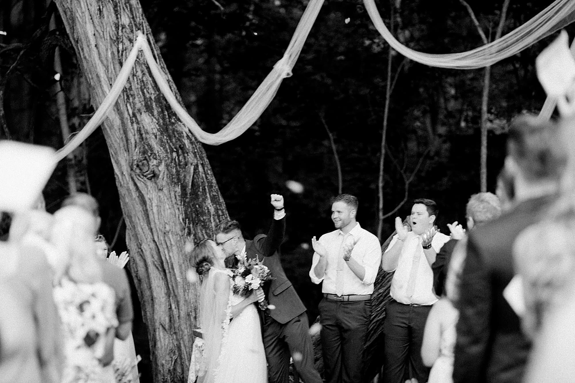 Arielle Peters Photography | Groom and bride kissing at the alter at outdoor wedding at Willowfield Lavender Farm in Mooresville, Indiana. 