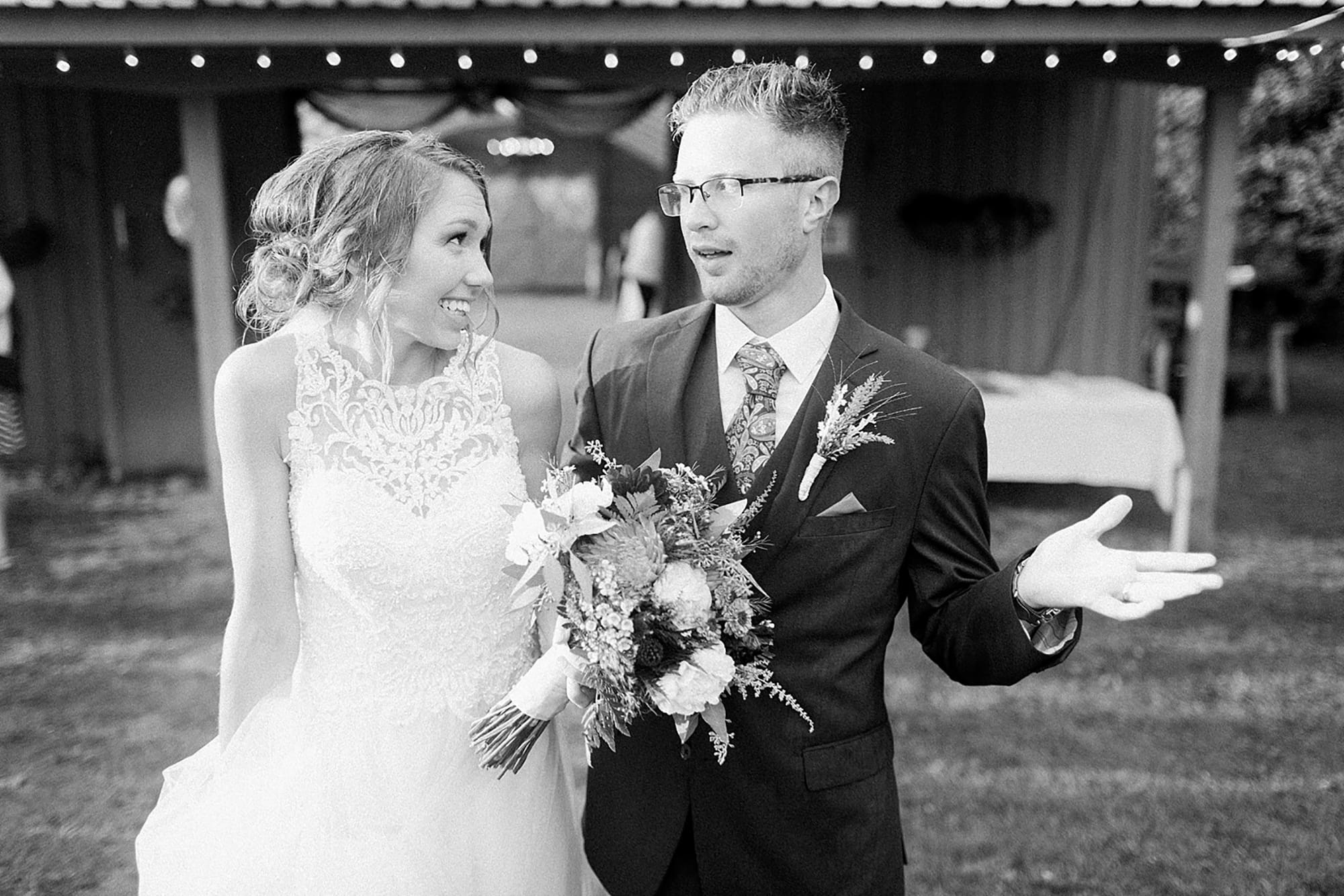 Arielle Peters Photography | Bride and groom laughing in the rain at an outdoor wedding at Willowfield Lavender Farm in Mooresville, Indiana. 