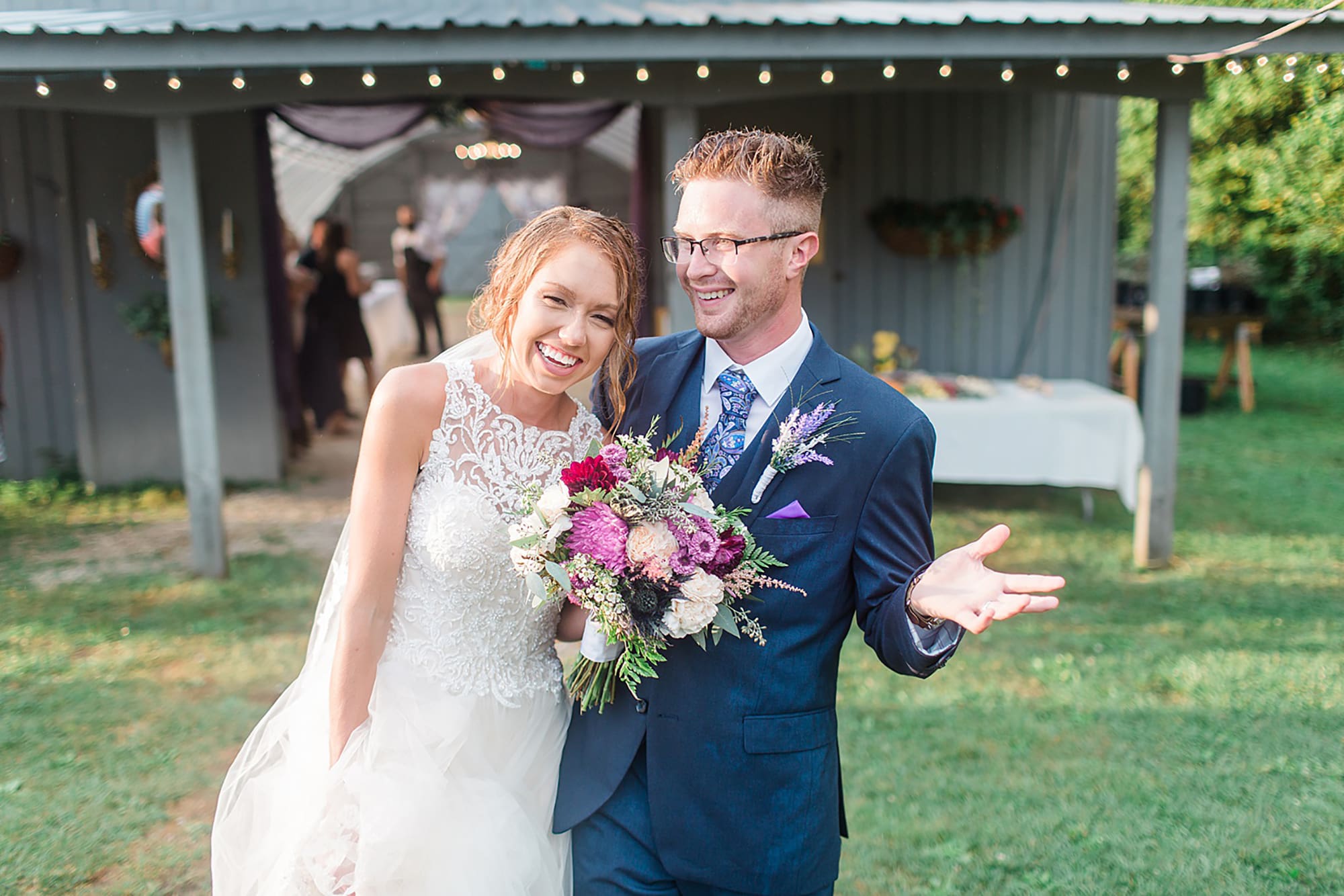 Arielle Peters Photography | Bride and groom laughing in the rain at an outdoor wedding at Willowfield Lavender Farm in Mooresville, Indiana. 
