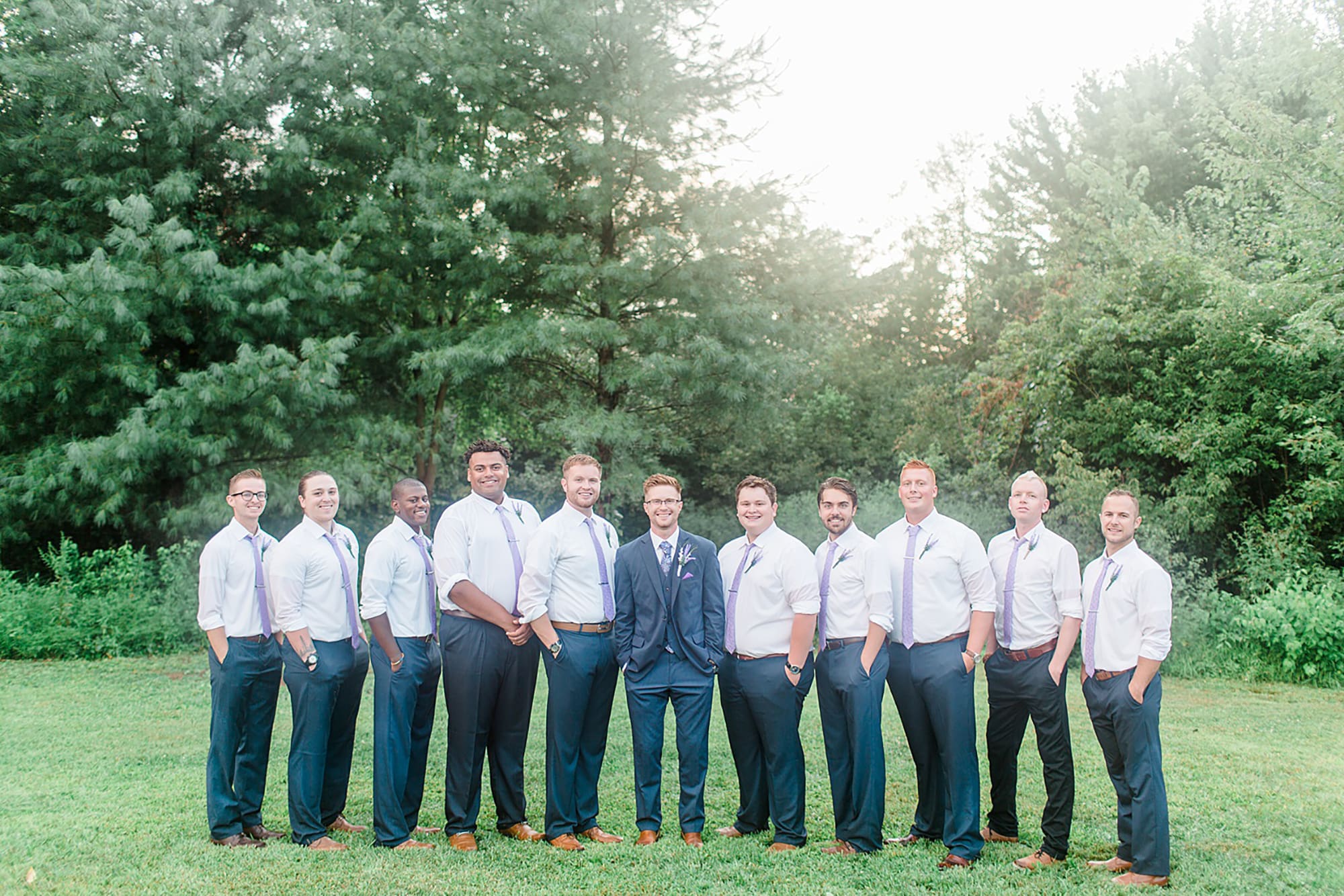 Arielle Peters Photography | Groom and groomsmen next to large trees at outdoor wedding at Willowfield Lavender Farm in Mooresville, Indiana. 