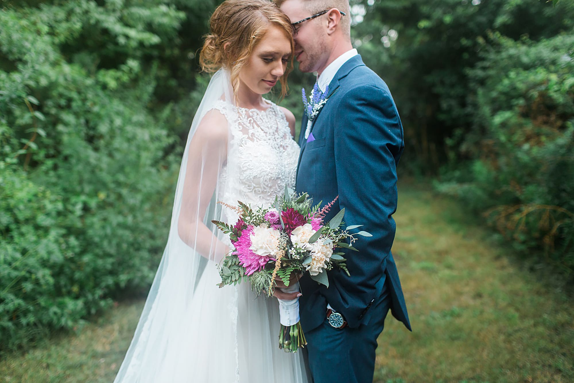 Arielle Peters Photography | Bride and groom under tunnel of trees at outdoor wedding at Willowfield Lavender Farm in Mooresville, Indiana. 