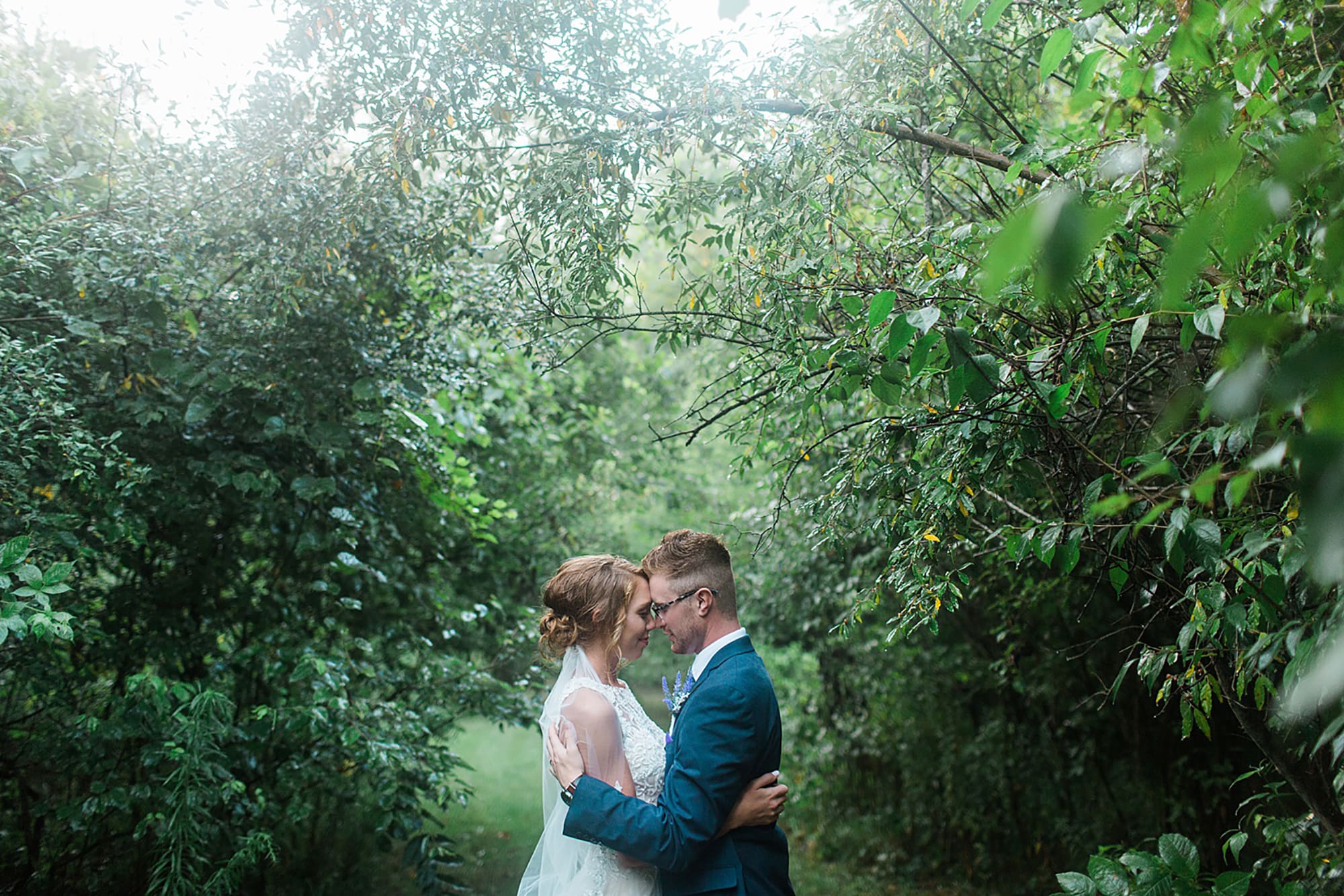 Arielle Peters Photography taking a couple’s wedding day photos at Willowfield Lavender Farm in Mooresville, Indiana.