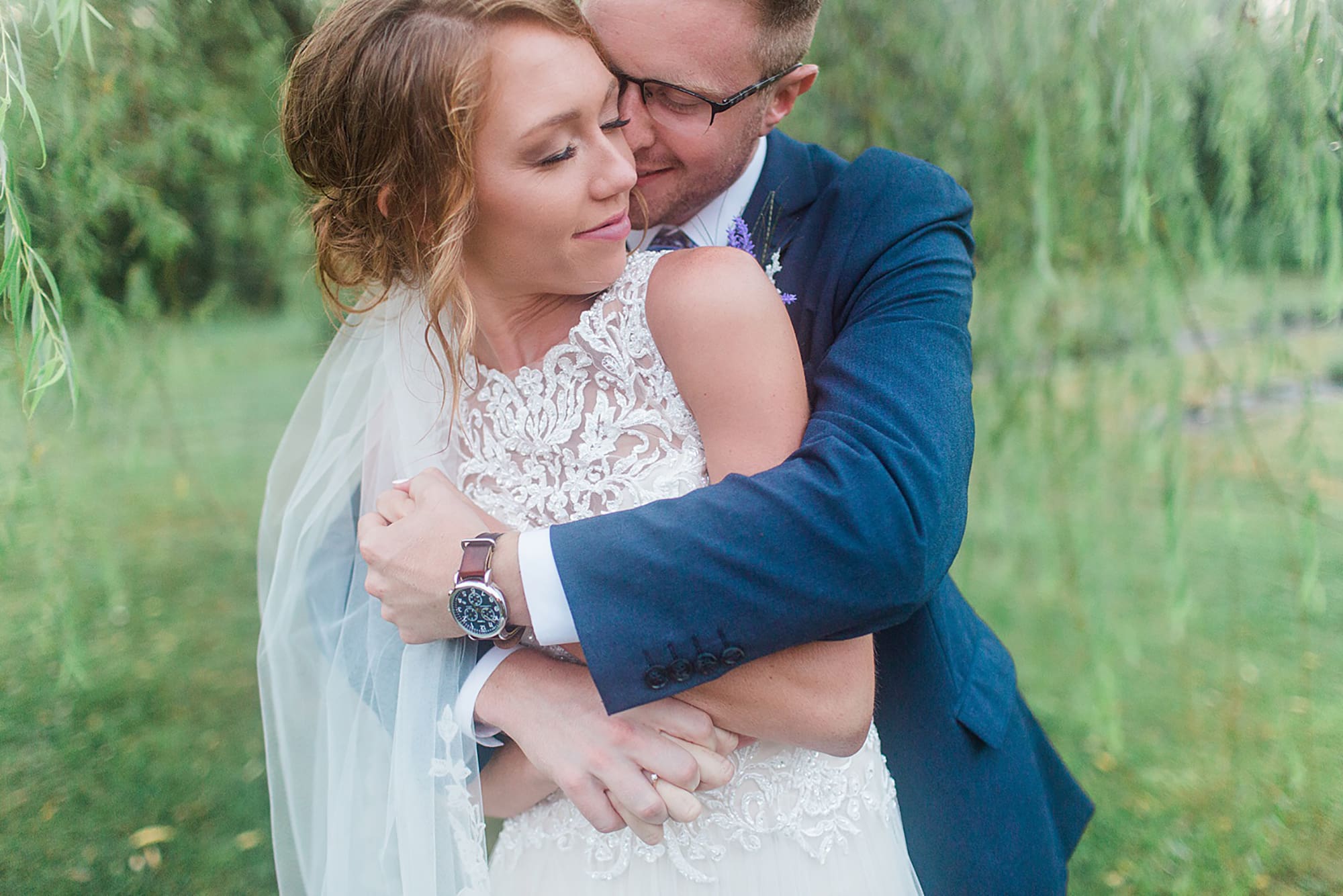 Arielle Peters Photography | Bride and groom hugging under willow tree at outdoor wedding at Willowfield Lavender Farm in Mooresville, Indiana. 