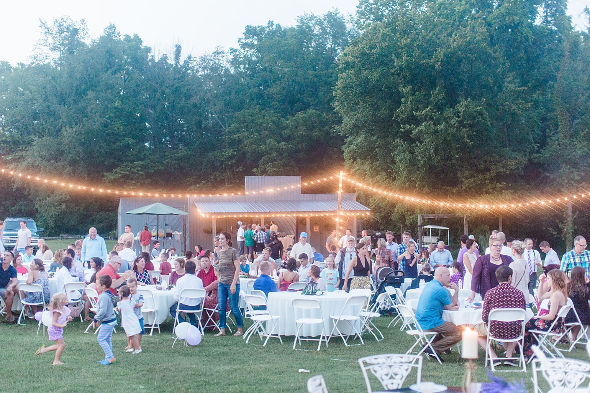Arielle Peters Photography | Outdoor wedding reception table settings and floral arrangements on wedding day at Willowfield Lavender Farm in Mooresville, Indiana. 