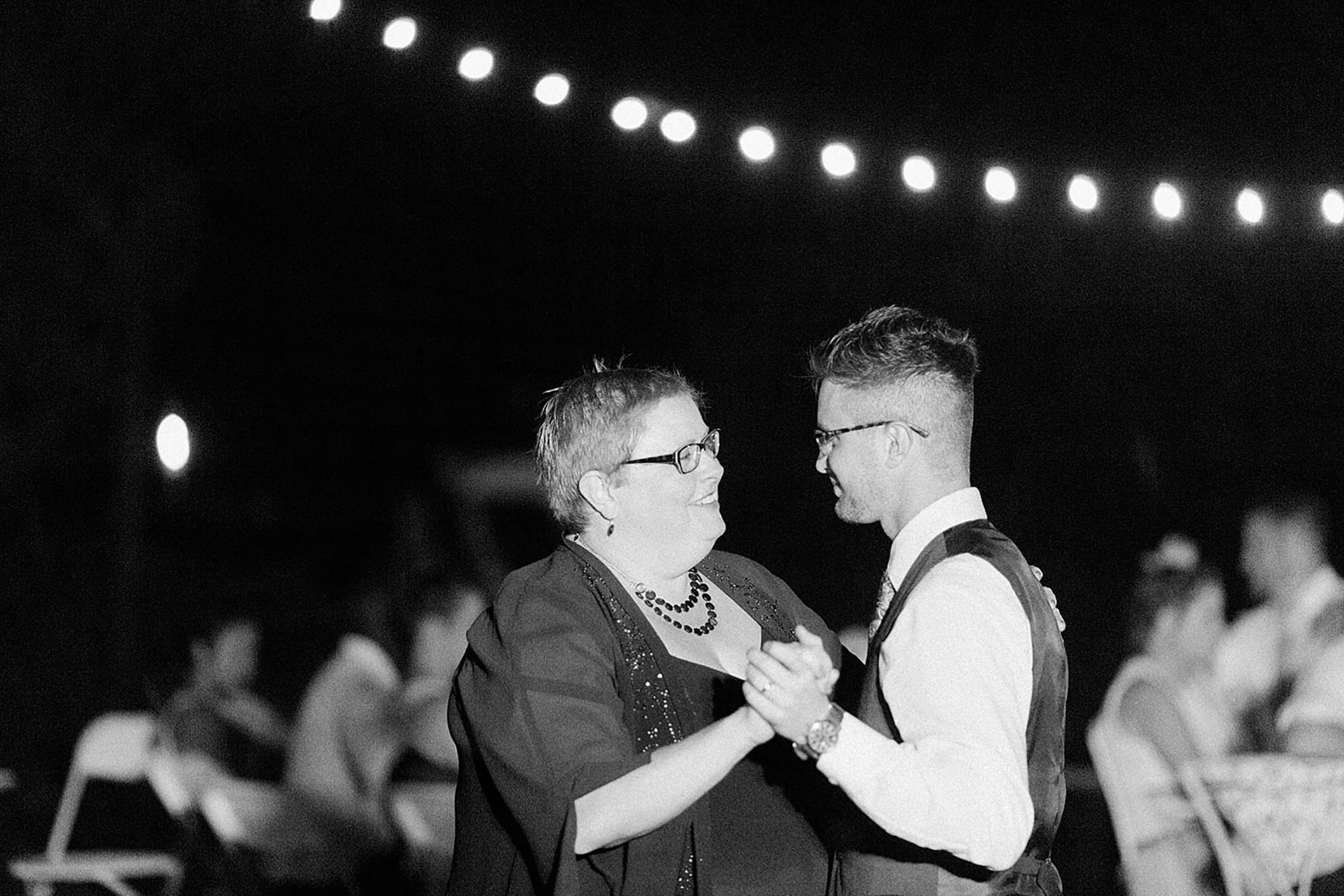 Arielle Peters Photography | Mother of groom and groom sharing a dance at wedding reception on wedding day at Willowfield Lavender Farm in Mooresville, Indiana. 