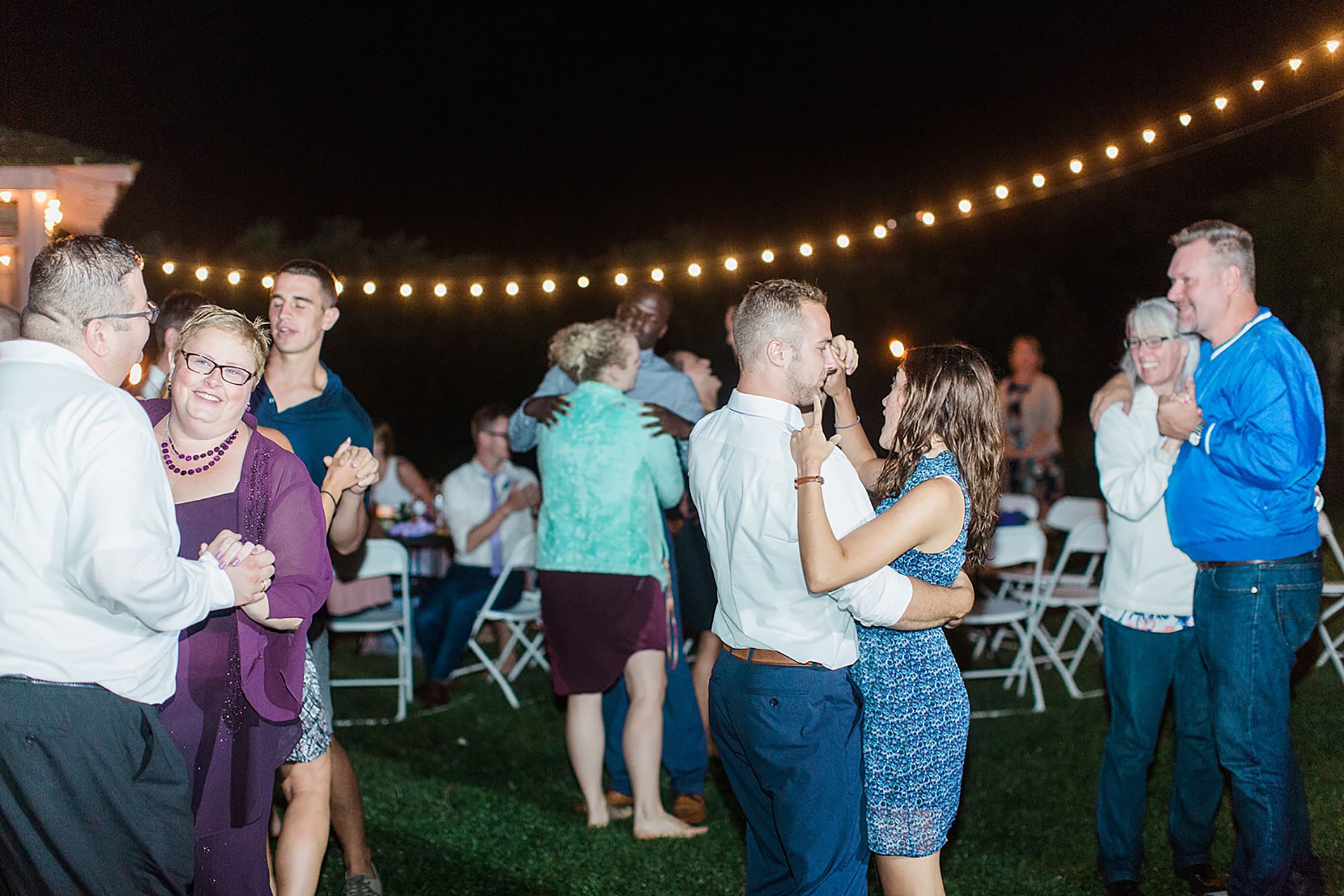 Arielle Peters Photography | Guests dancing at outdoor wedding reception on wedding day at Willowfield Lavender Farm in Mooresville, Indiana. 