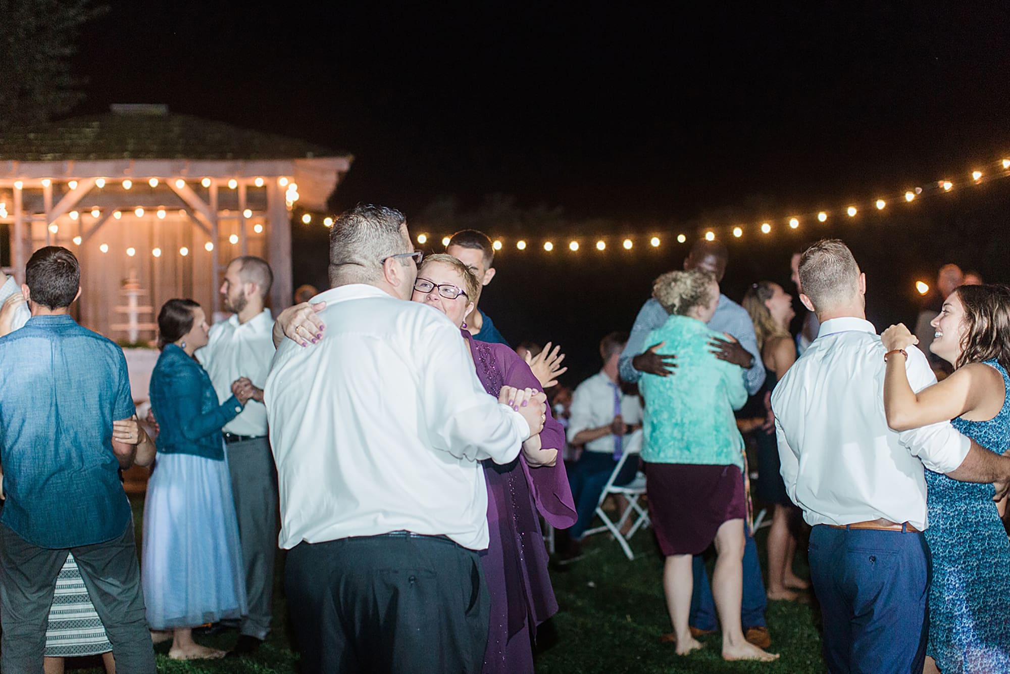 Arielle Peters Photography | Guests dancing at outdoor wedding reception on wedding day at Willowfield Lavender Farm in Mooresville, Indiana. 