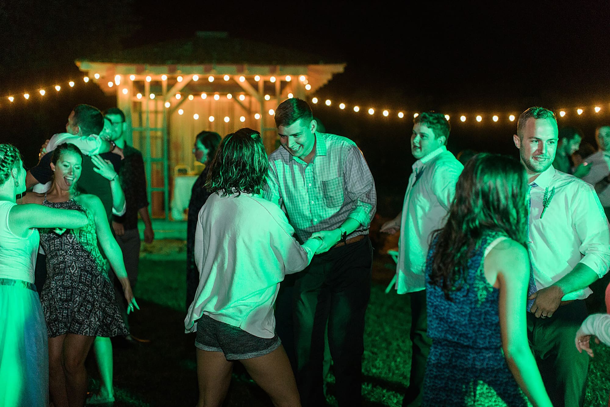 Arielle Peters Photography | Guests dancing at outdoor wedding reception on wedding day at Willowfield Lavender Farm in Mooresville, Indiana. 
