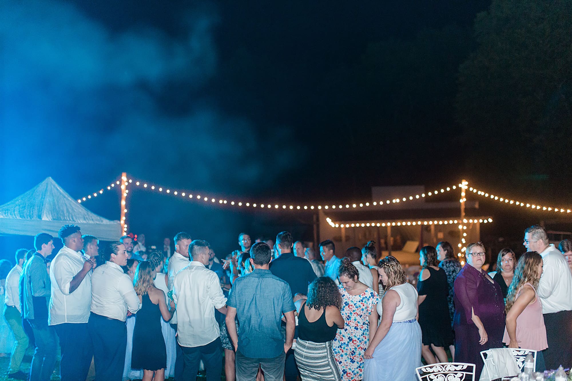 Arielle Peters Photography | Guests dancing at outdoor wedding reception on wedding day at Willowfield Lavender Farm in Mooresville, Indiana. 