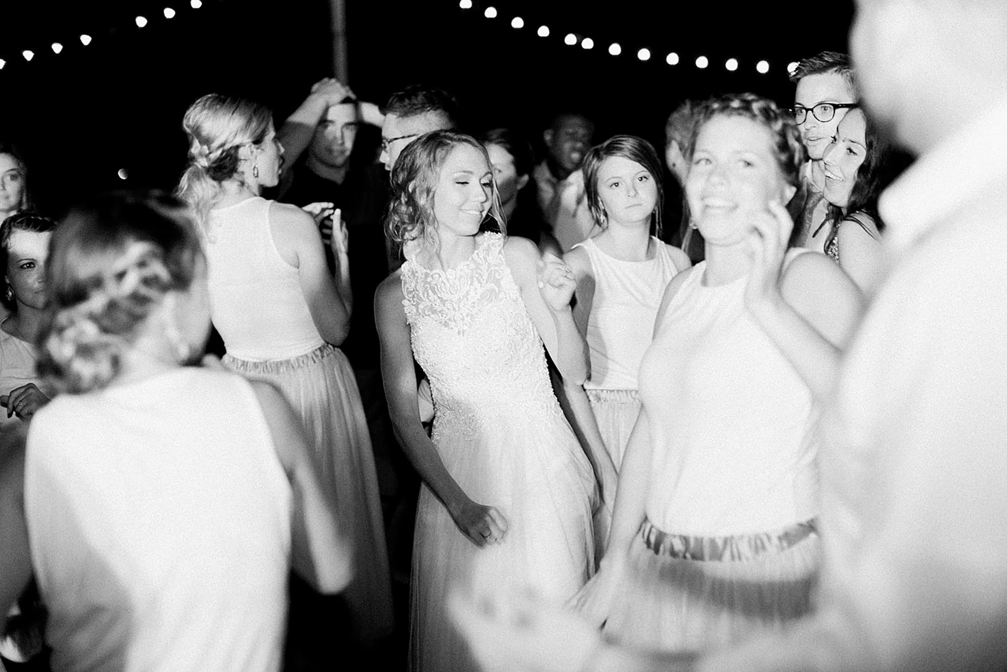 Arielle Peters Photography | Guests dancing at outdoor wedding reception on wedding day at Willowfield Lavender Farm in Mooresville, Indiana. 