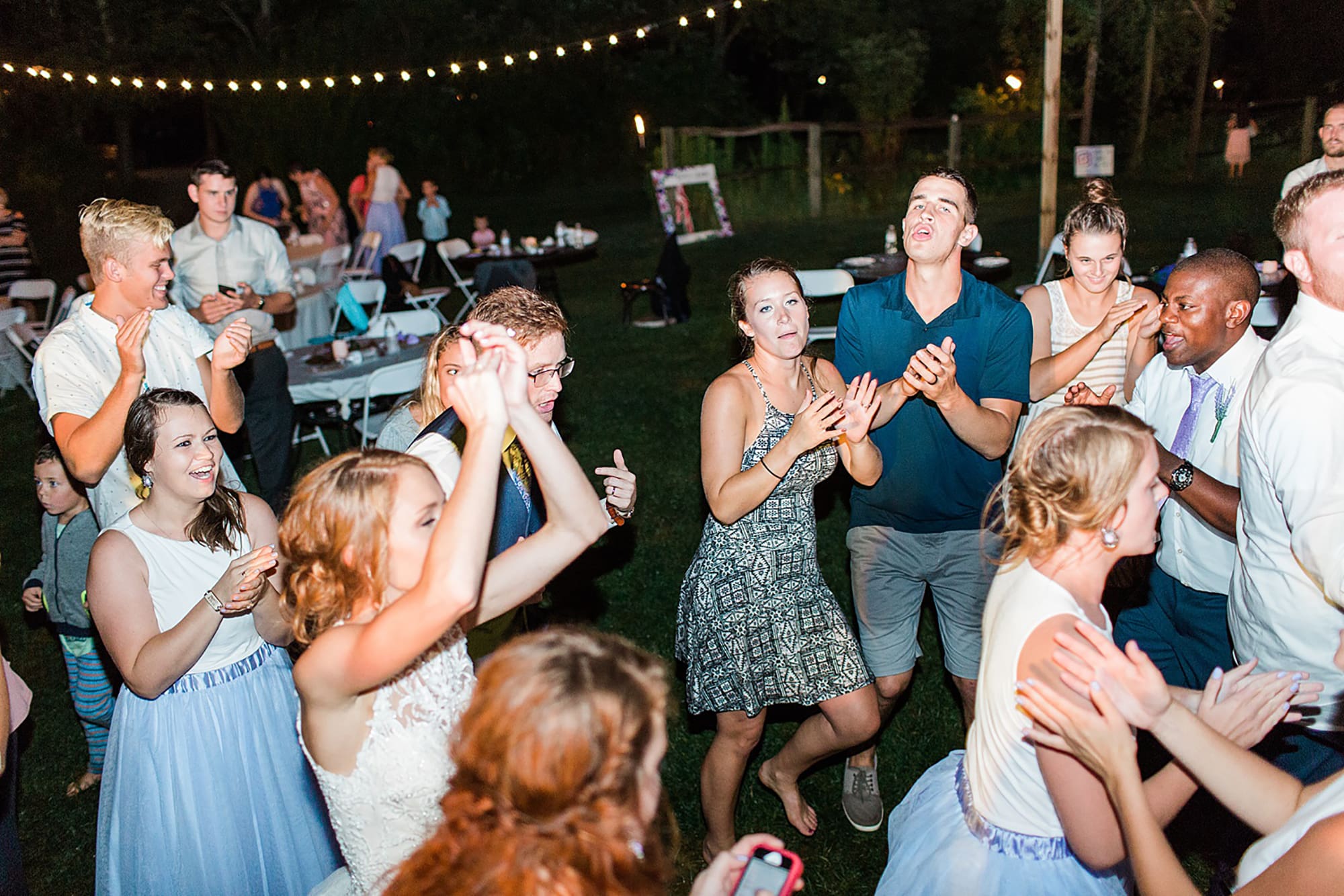 Arielle Peters Photography | Guests dancing at outdoor wedding reception on wedding day at Willowfield Lavender Farm in Mooresville, Indiana. 