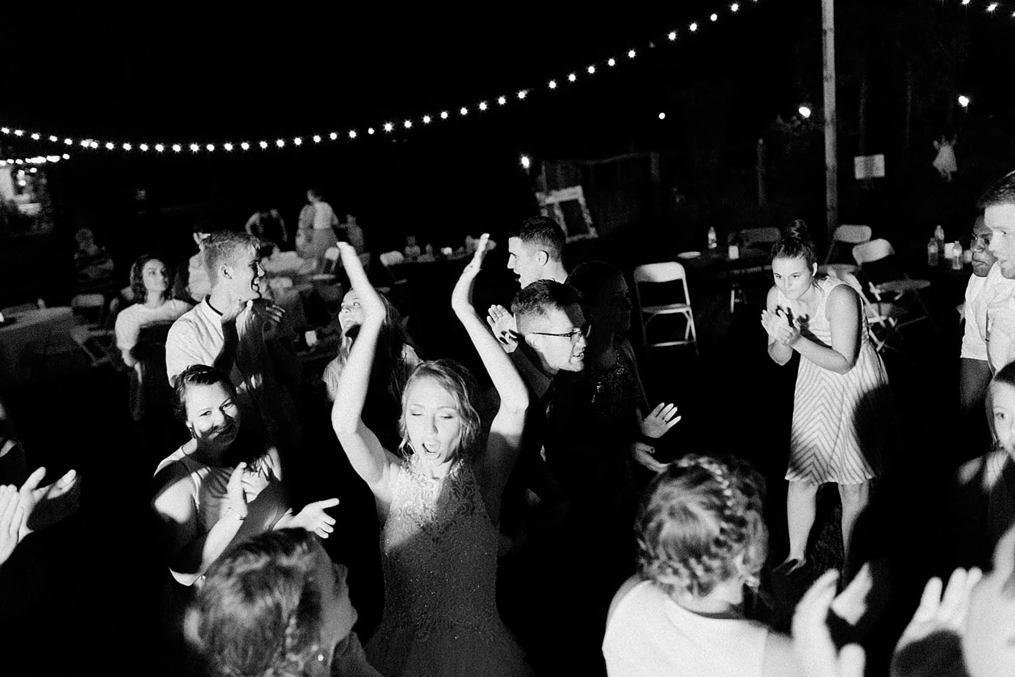 Arielle Peters Photography | Guests dancing at outdoor wedding reception on wedding day at Willowfield Lavender Farm in Mooresville, Indiana. 