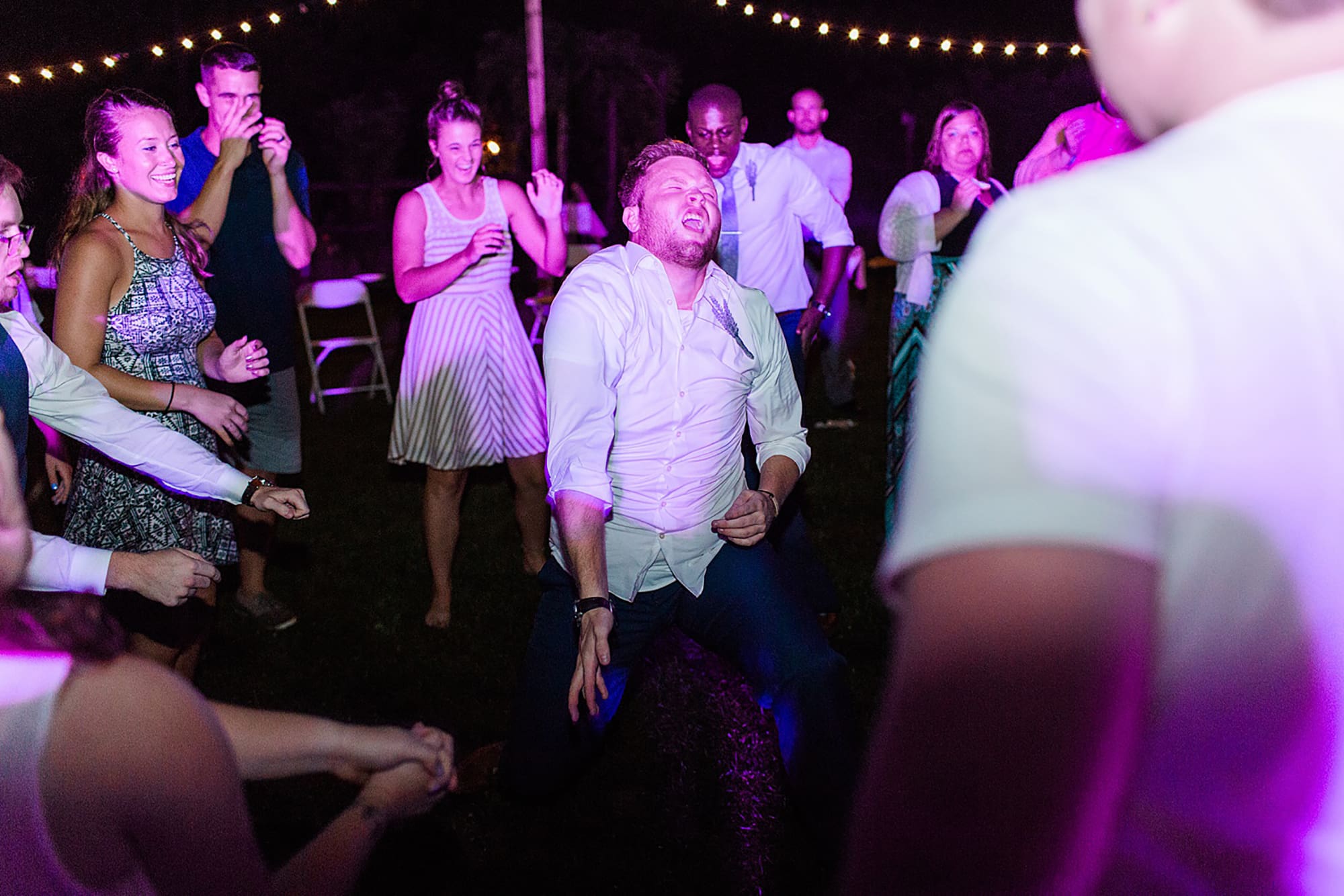 Arielle Peters Photography | Guests dancing at outdoor wedding reception on wedding day at Willowfield Lavender Farm in Mooresville, Indiana. 