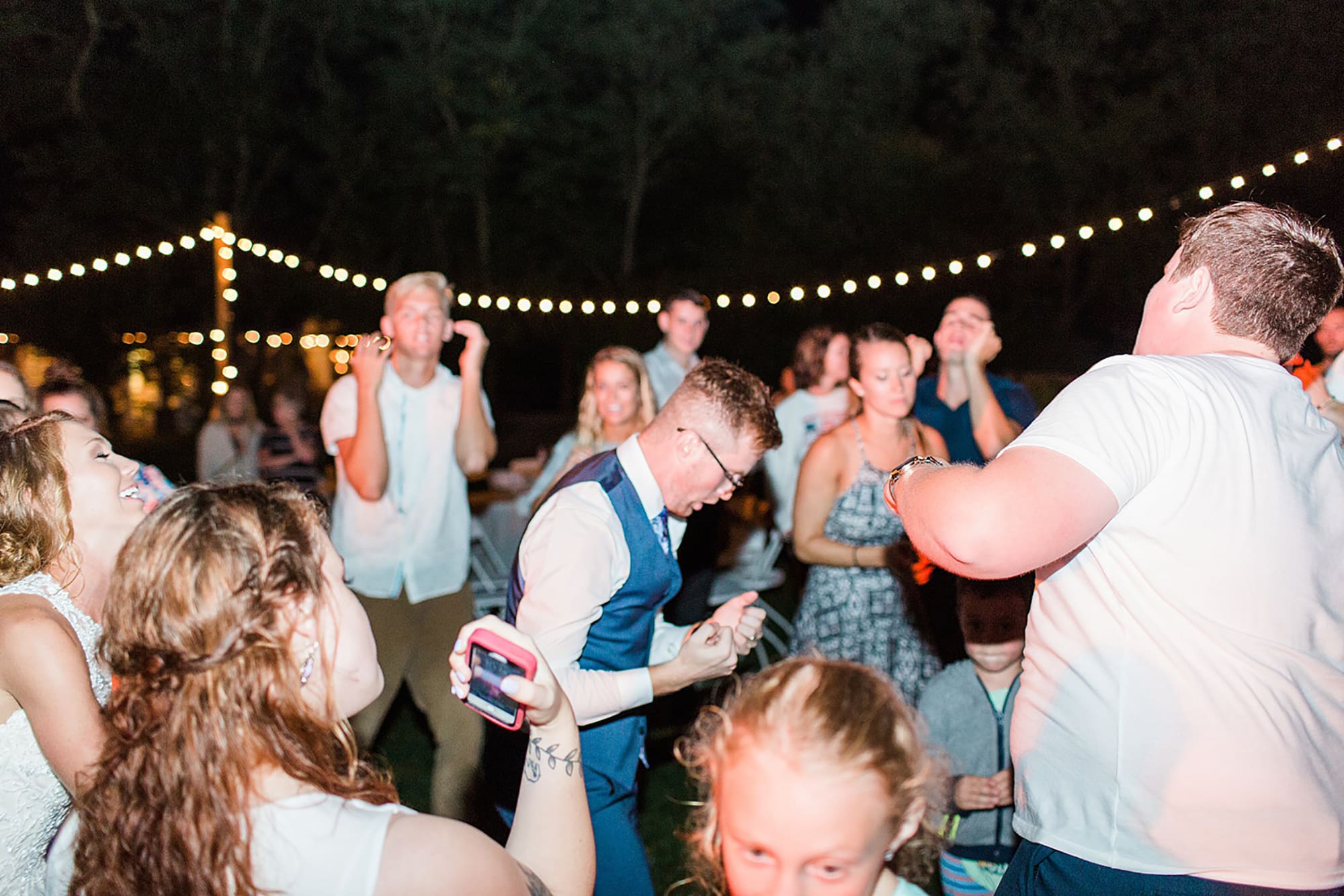 Arielle Peters Photography | Guests dancing at outdoor wedding reception on wedding day at Willowfield Lavender Farm in Mooresville, Indiana. 