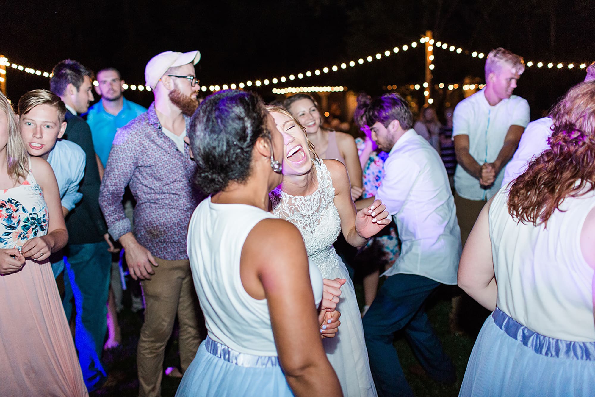 Arielle Peters Photography | Guests dancing at outdoor wedding reception on wedding day at Willowfield Lavender Farm in Mooresville, Indiana. 