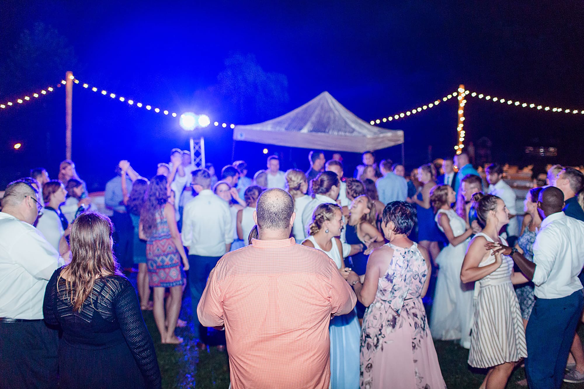 Arielle Peters Photography | Guests dancing at outdoor wedding reception on wedding day at Willowfield Lavender Farm in Mooresville, Indiana. 