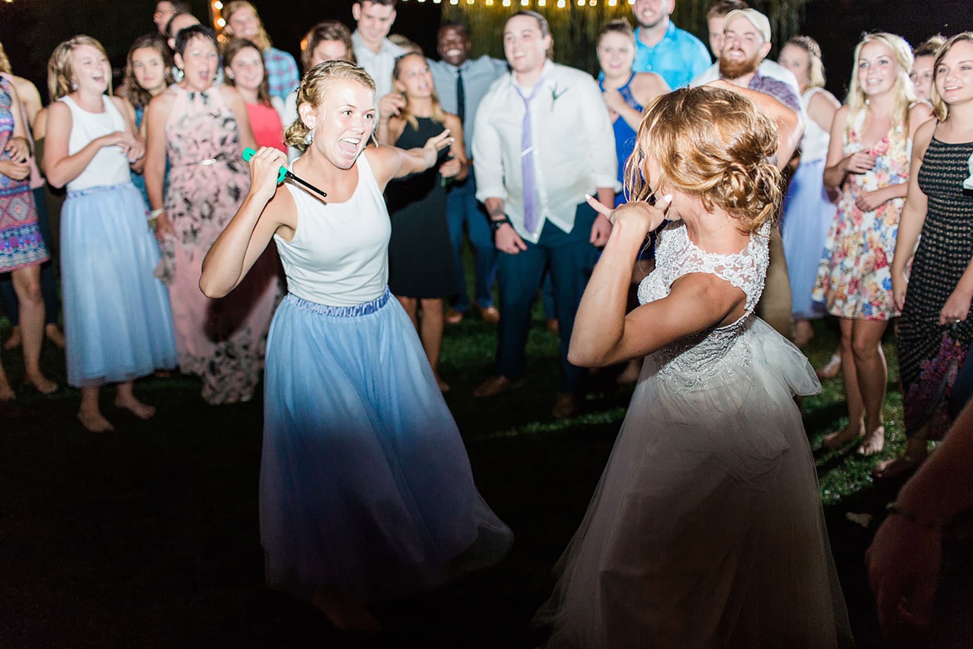Arielle Peters Photography | Guests dancing at outdoor wedding reception on wedding day at Willowfield Lavender Farm in Mooresville, Indiana. 