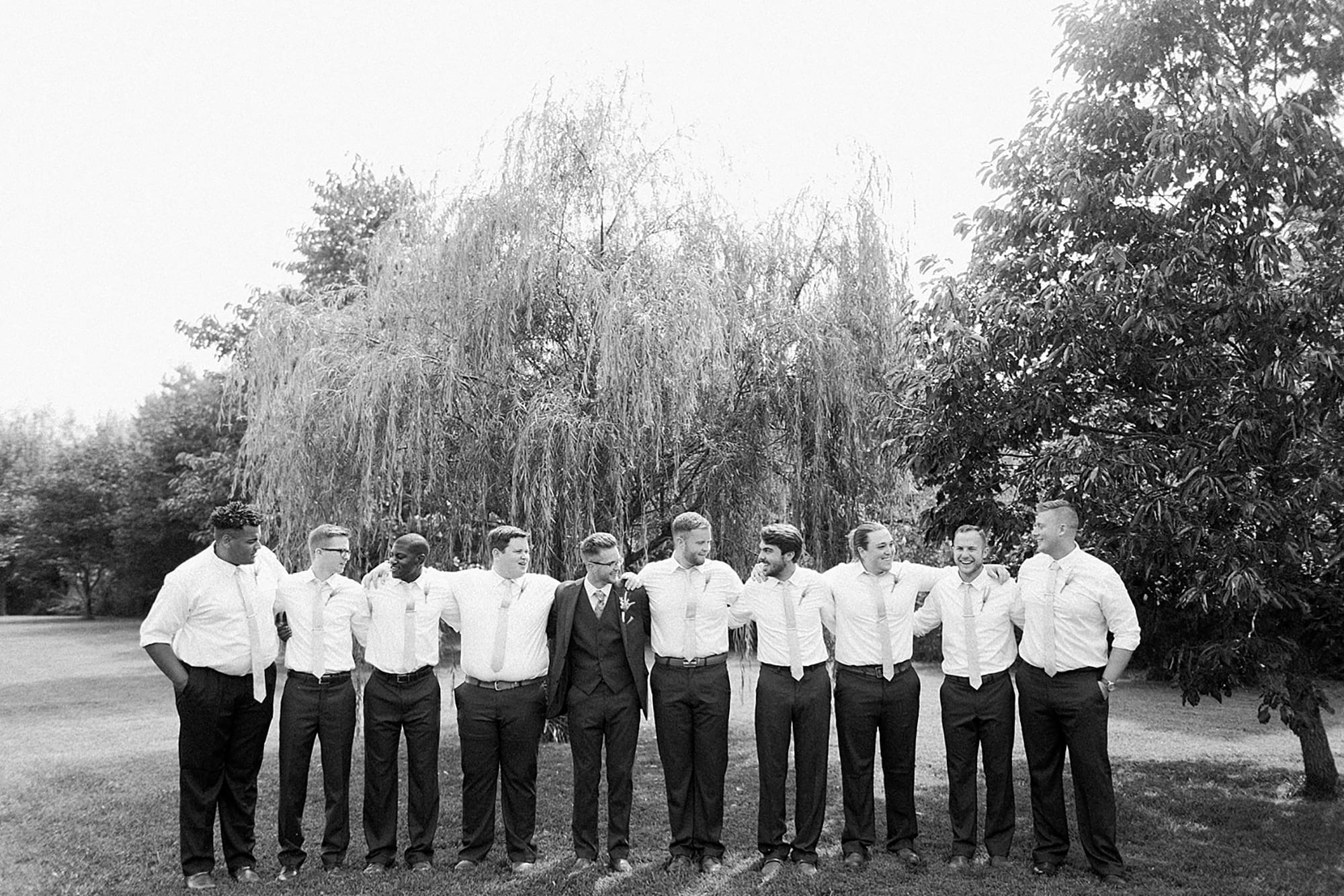 Arielle Peters Photography | Groom and groomsmen under willow tree on wedding day at Willowfield Lavender Farm in Mooresville, Indiana. 