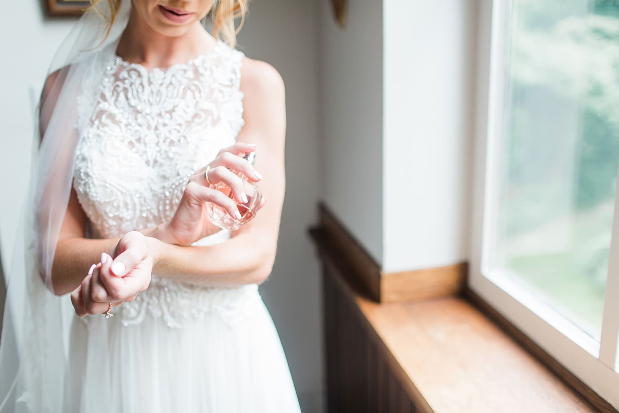 Arielle Peters Photography | Bride putting on her perfume on wedding day at Willowfield Lavender Farm in Mooresville, Indiana. 