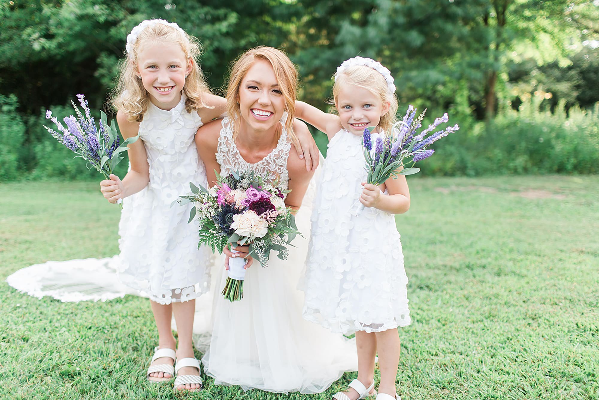 Arielle Peters Photography | Bride and flower girls holding lavender on wedding day at Willowfield Lavender Farm in Mooresville, Indiana. 