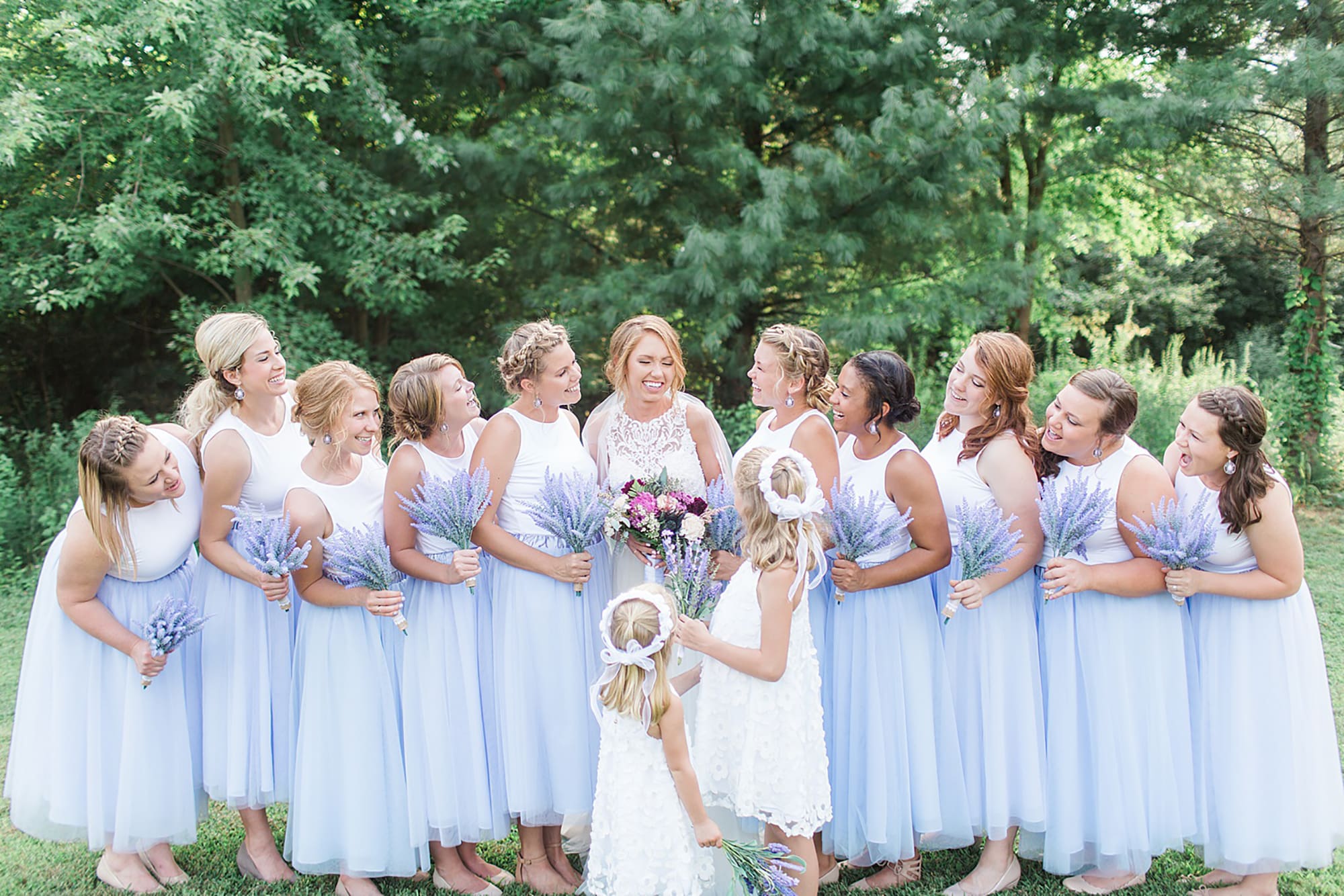 Arielle Peters Photography | Bride and bridesmaids next to large trees on wedding day at Willowfield Lavender Farm in Mooresville, Indiana. 