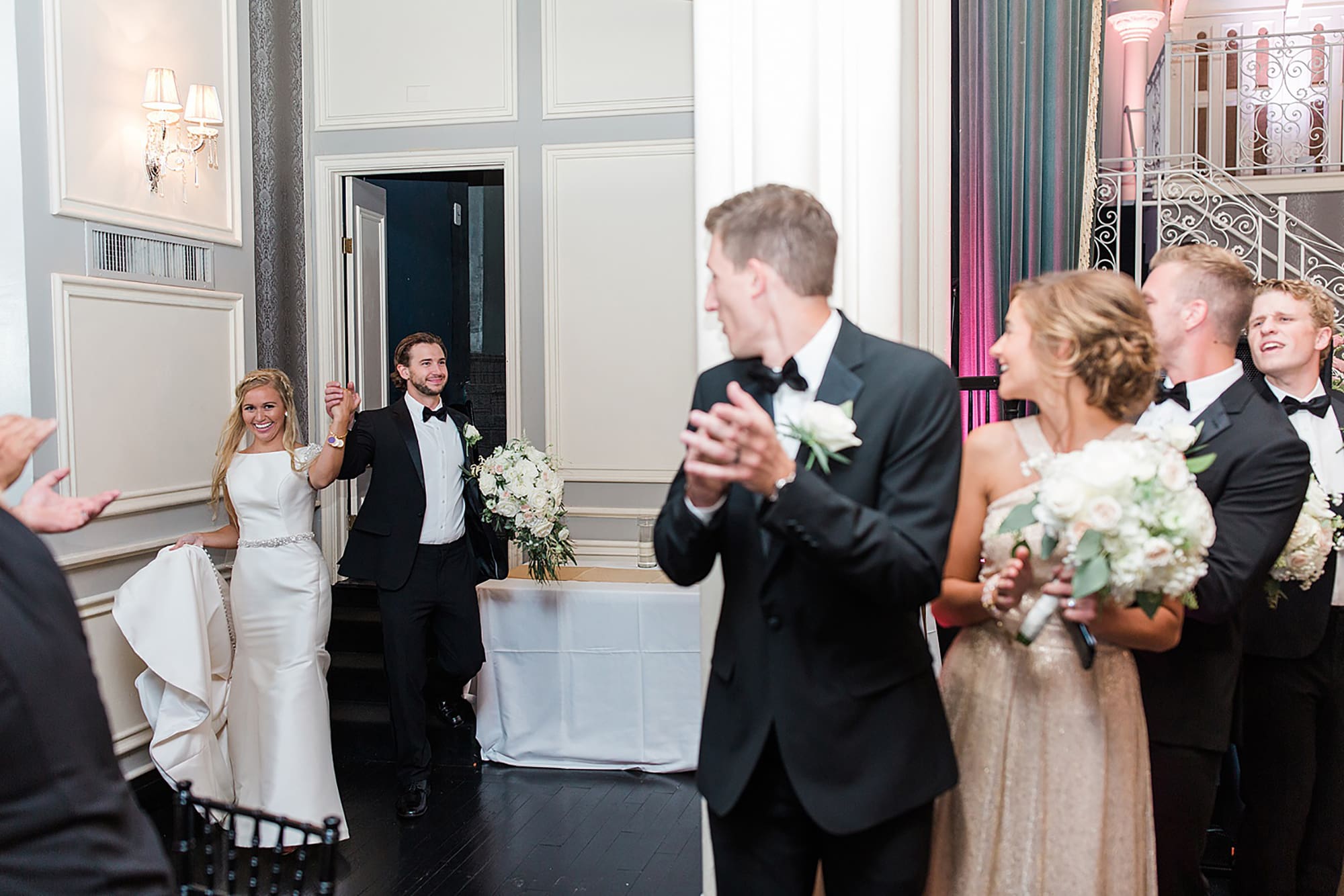 Arielle Peters Photography | Bride and groom entering wedding reception on wedding day at the Uptown Center in Michigan City, Indiana.