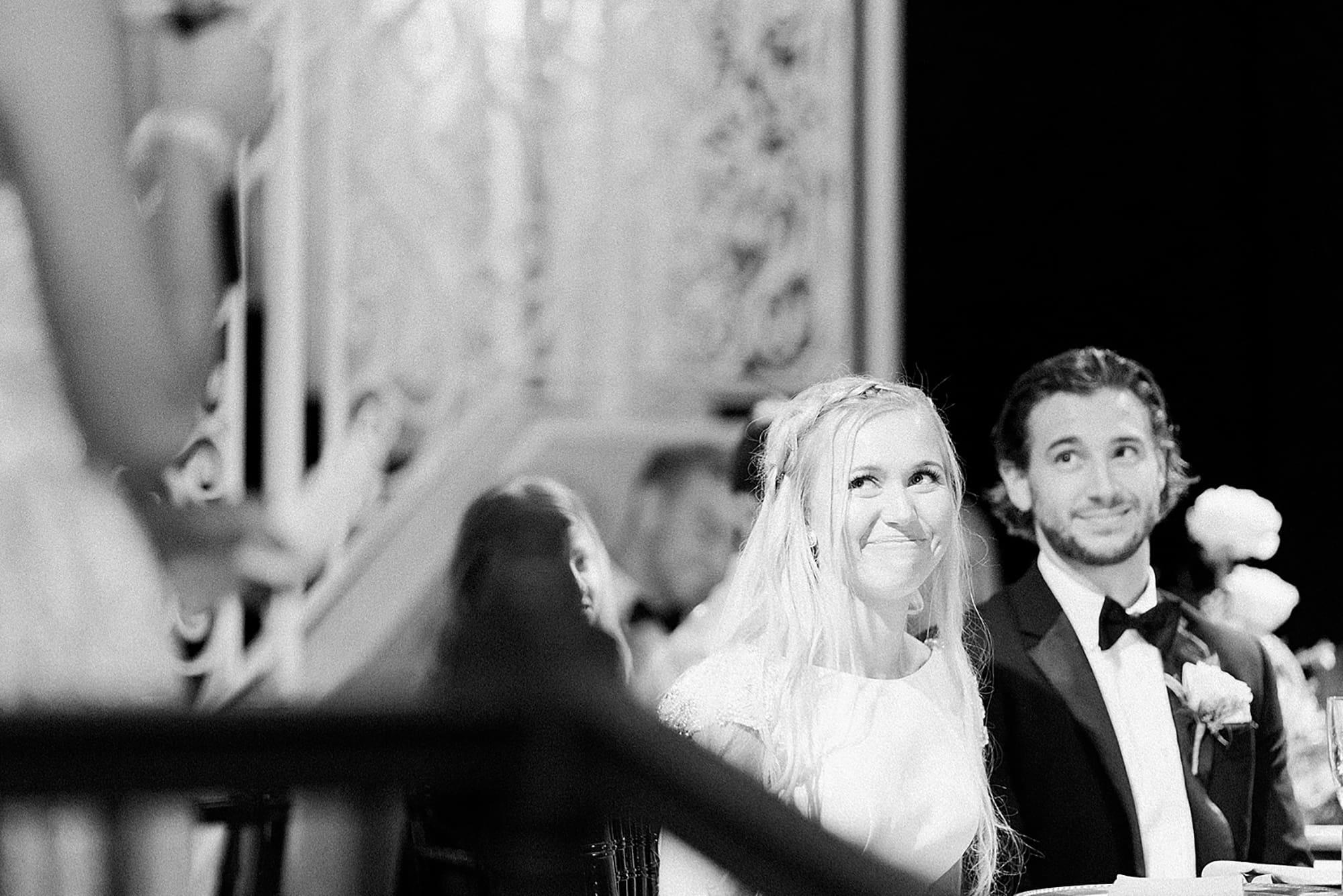 Arielle Peters Photography | Bride and groom smiling at wedding reception on wedding day at the Uptown Center in Michigan City, Indiana.
