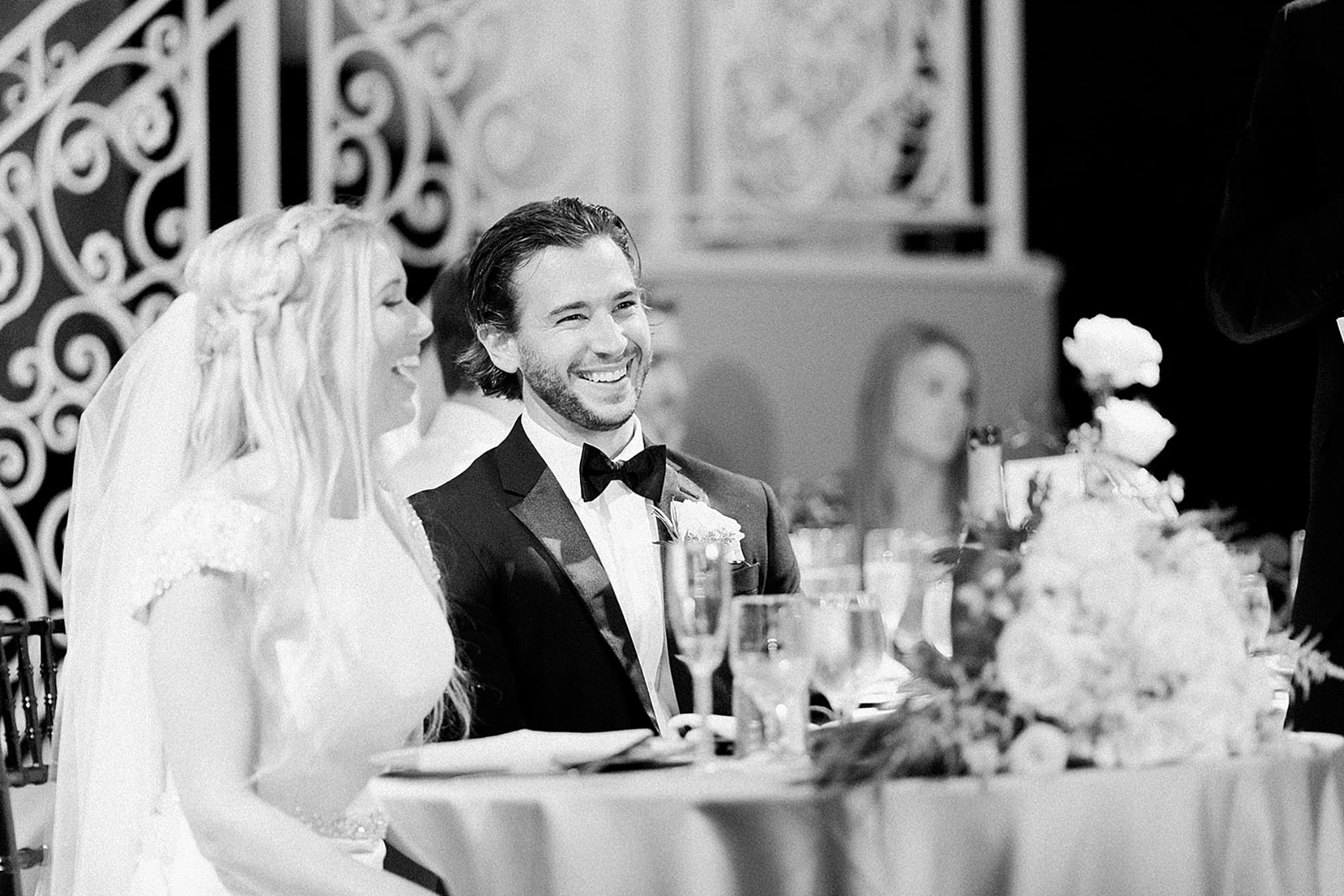Arielle Peters Photography | Bride and groom laughing at wedding reception on wedding day at the Uptown Center in Michigan City, Indiana.