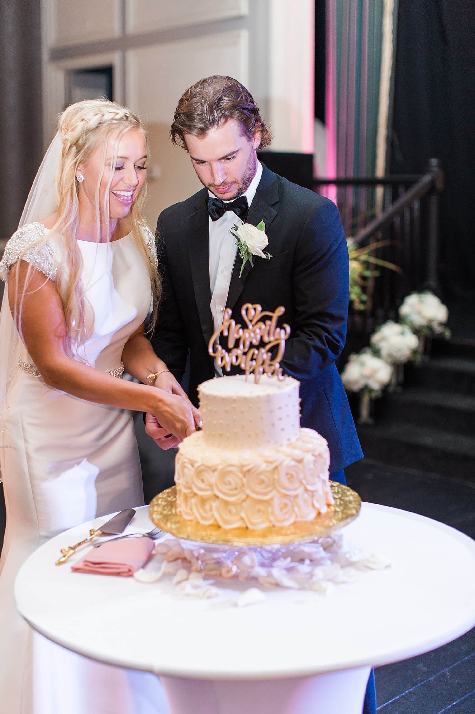 Arielle Peters Photography | Bride and groom cutting the cake at wedding reception on wedding day at the Uptown Center in Michigan City, Indiana.