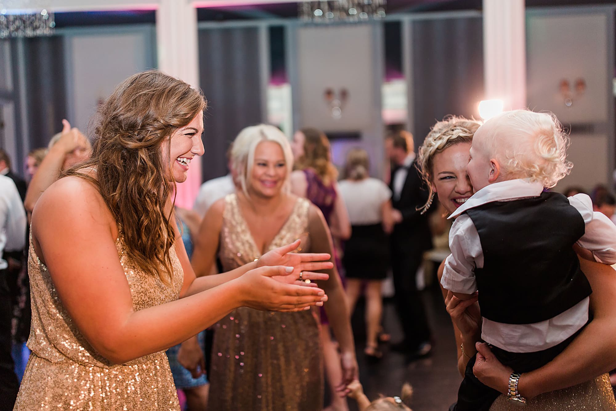 Arielle Peters Photography | Wedding guests dancing at wedding reception on wedding day at the Uptown Center in Michigan City, Indiana.