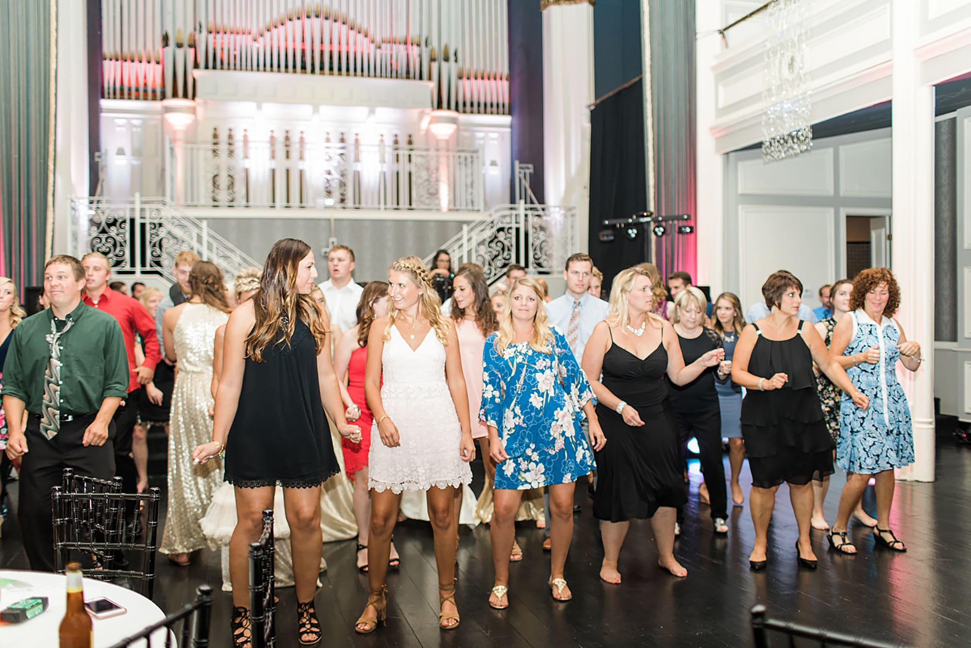 Arielle Peters Photography | Wedding guests dancing at wedding reception on wedding day at the Uptown Center in Michigan City, Indiana.