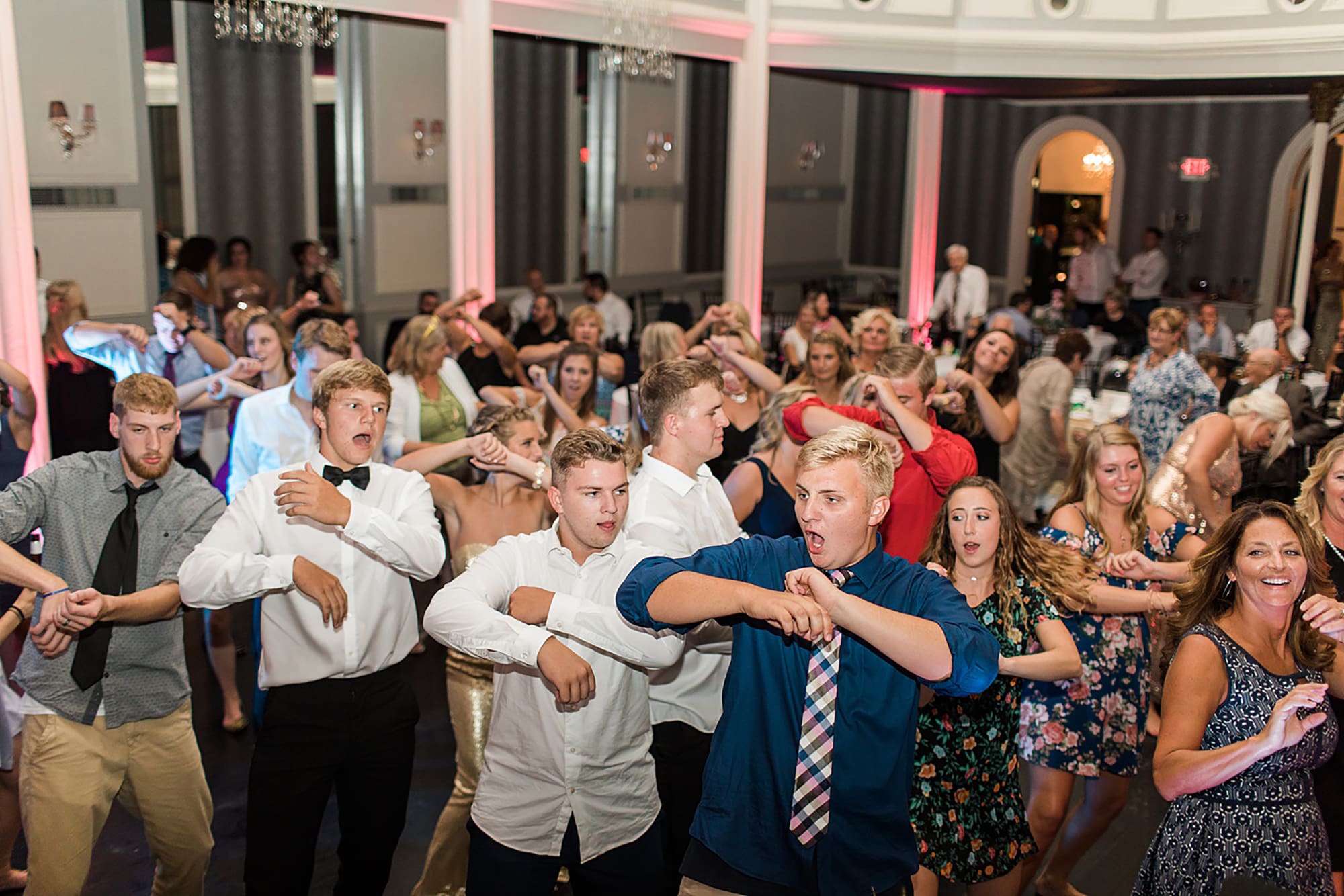 Arielle Peters Photography | Wedding guests dancing at wedding reception on wedding day at the Uptown Center in Michigan City, Indiana.
