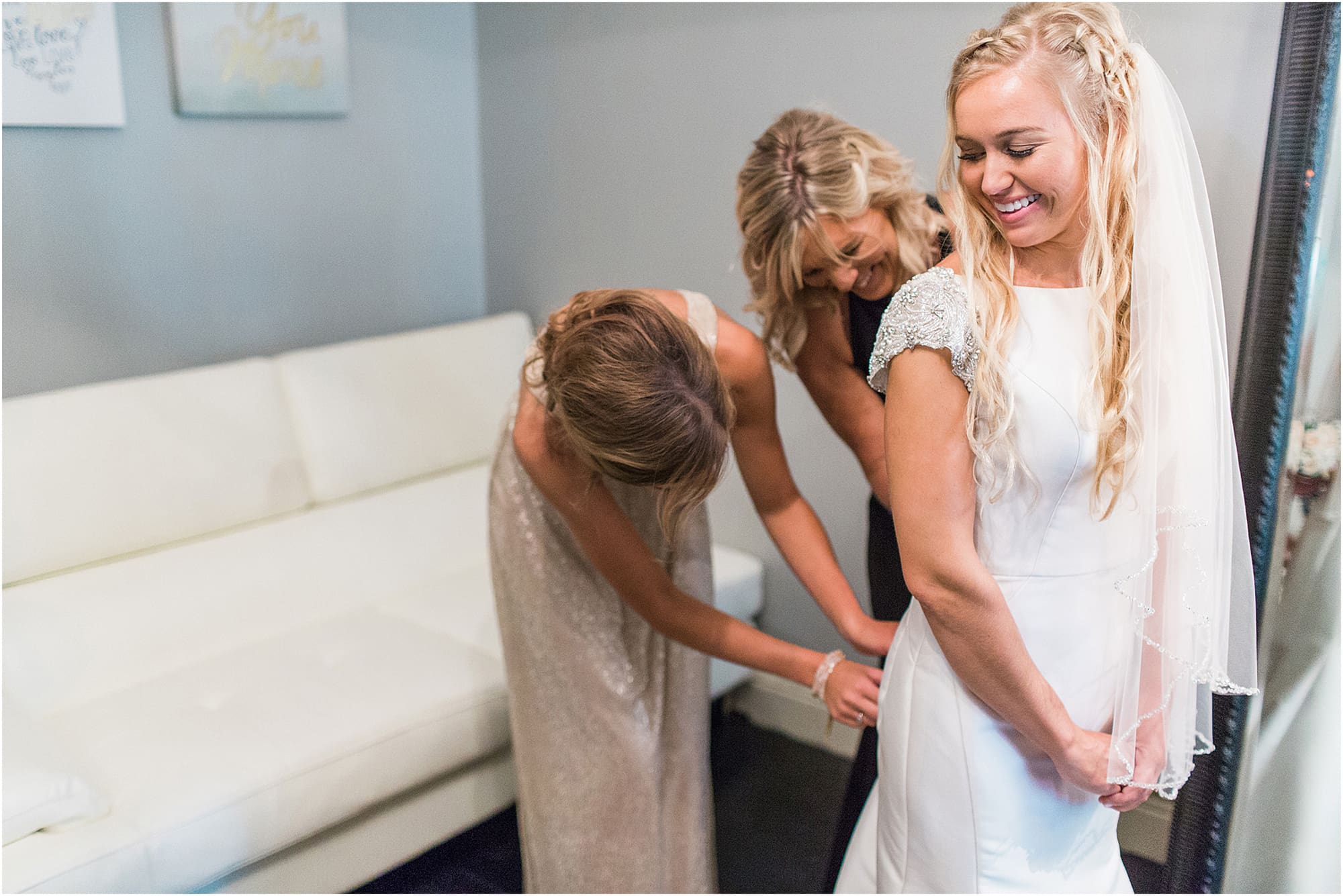 Arielle Peters Photography | Mother of bride helping bride get ready on wedding day at the Uptown Center in Michigan City, Indiana.