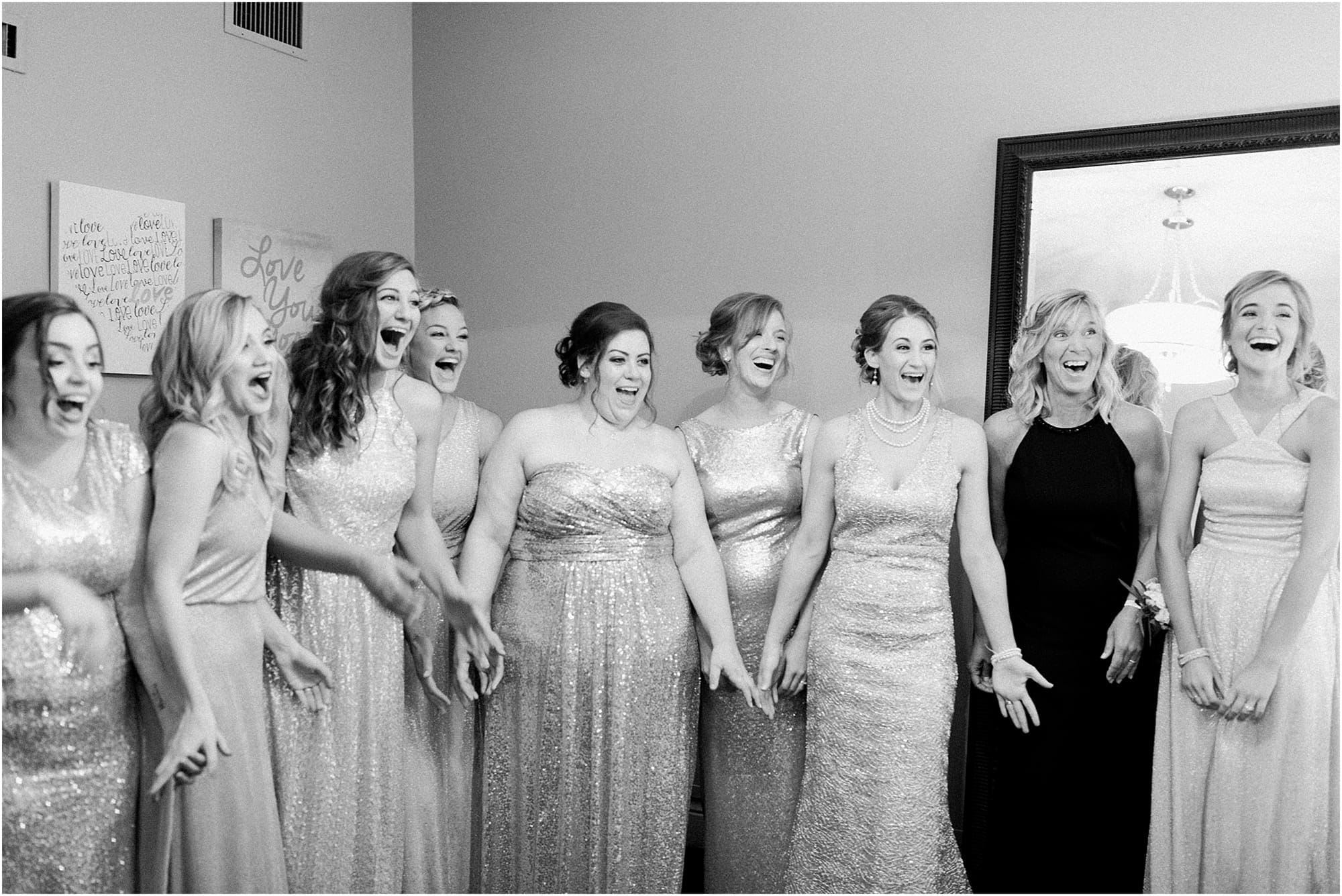 Arielle Peters Photography | Bride and bridesmaids having first reveal on wedding day at the Uptown Center in Michigan City, Indiana.