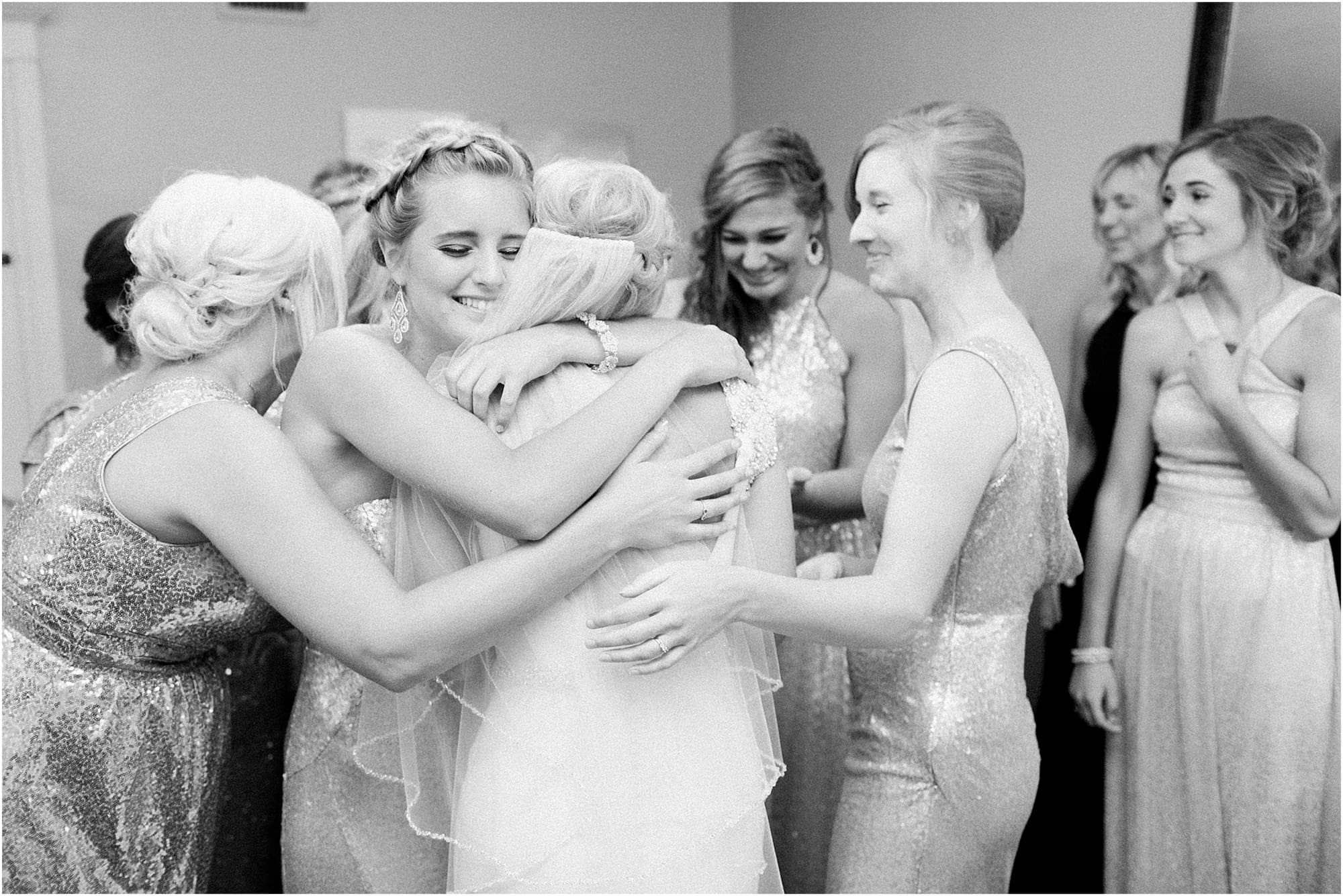 Arielle Peters Photography | Bride and bridesmaids having first reveal on wedding day at the Uptown Center in Michigan City, Indiana.