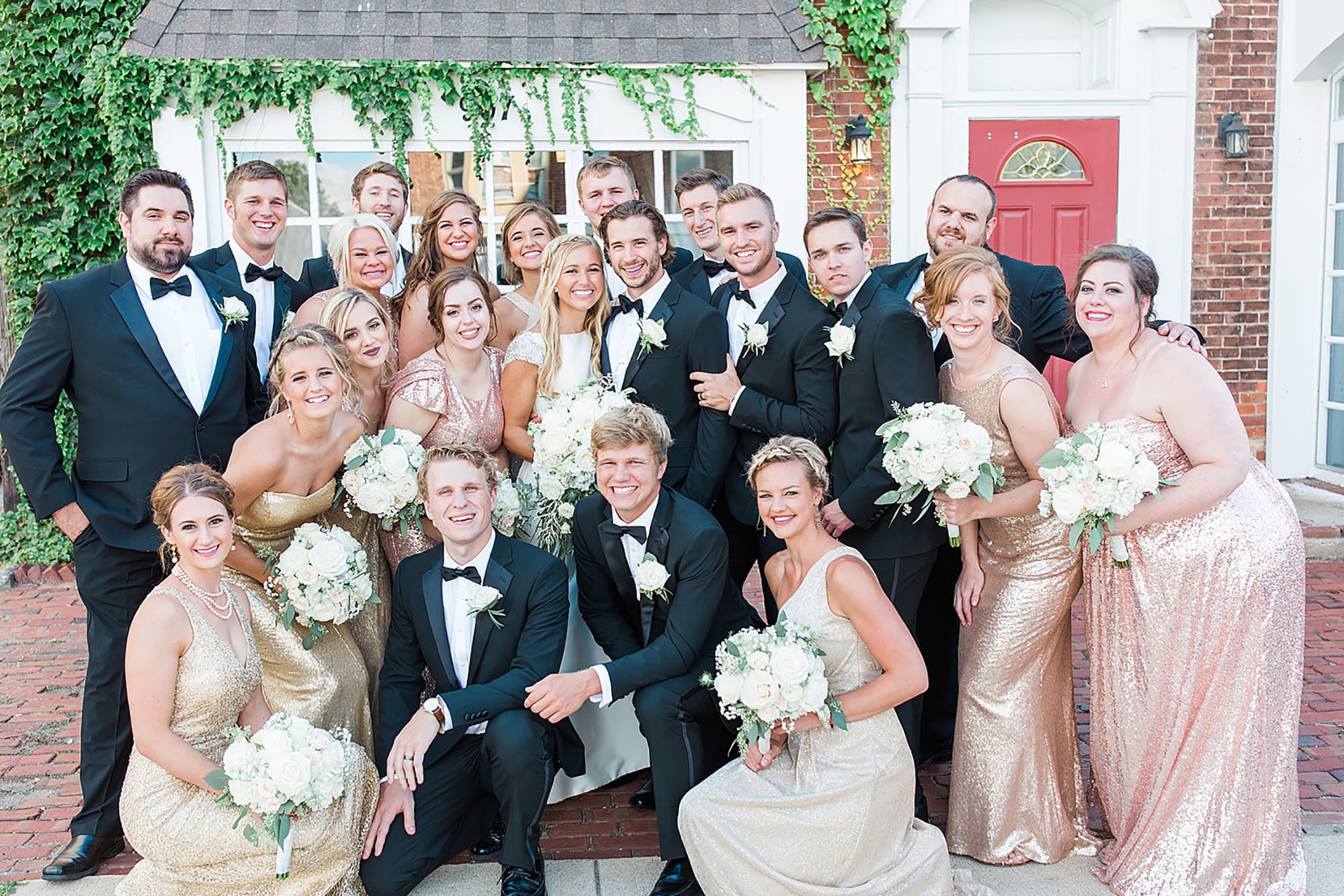 Arielle Peters Photography | Wedding party next to ivy-covered building on wedding day at the Uptown Center in Michigan City, Indiana.