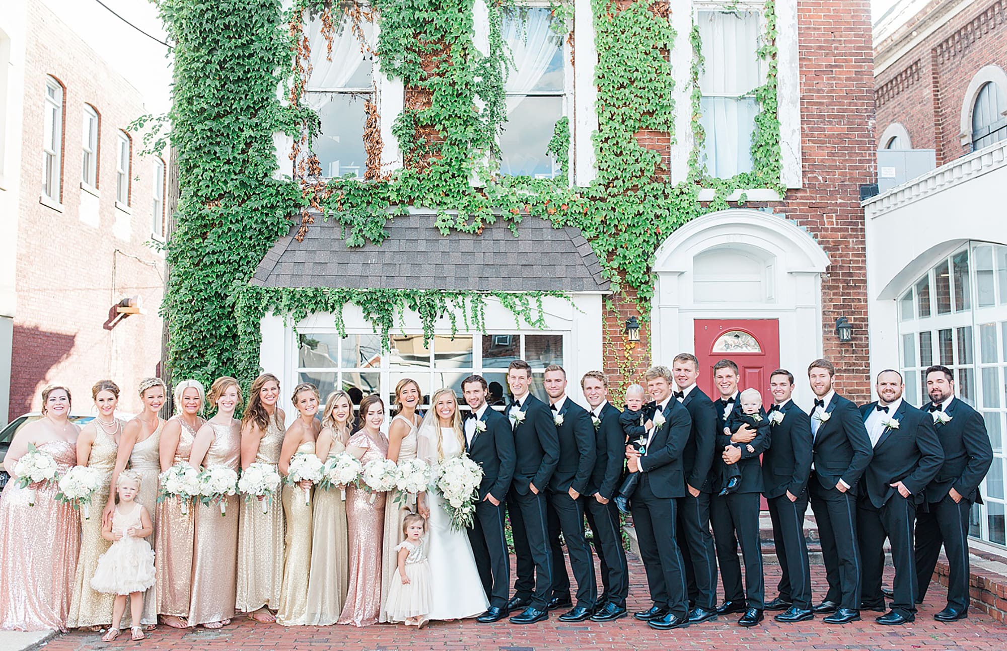 Arielle Peters Photography | Bride and groom next to ivy-covered walls on wedding day at the Uptown Center in Michigan City, Indiana.