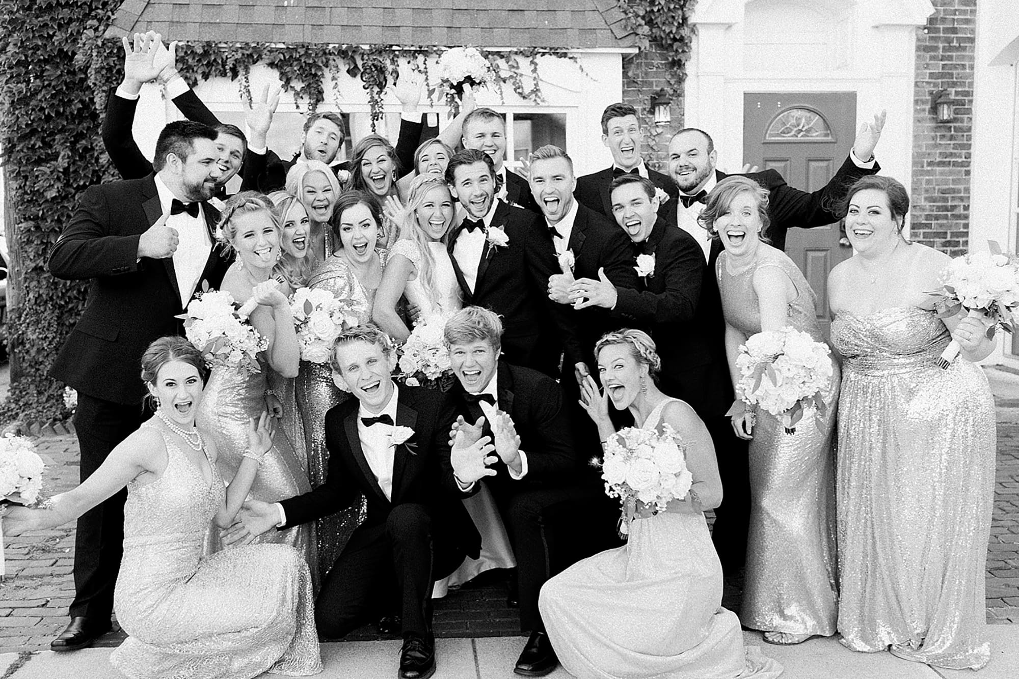 Arielle Peters Photography | Wedding party next to ivy-covered building on wedding day at the Uptown Center in Michigan City, Indiana.